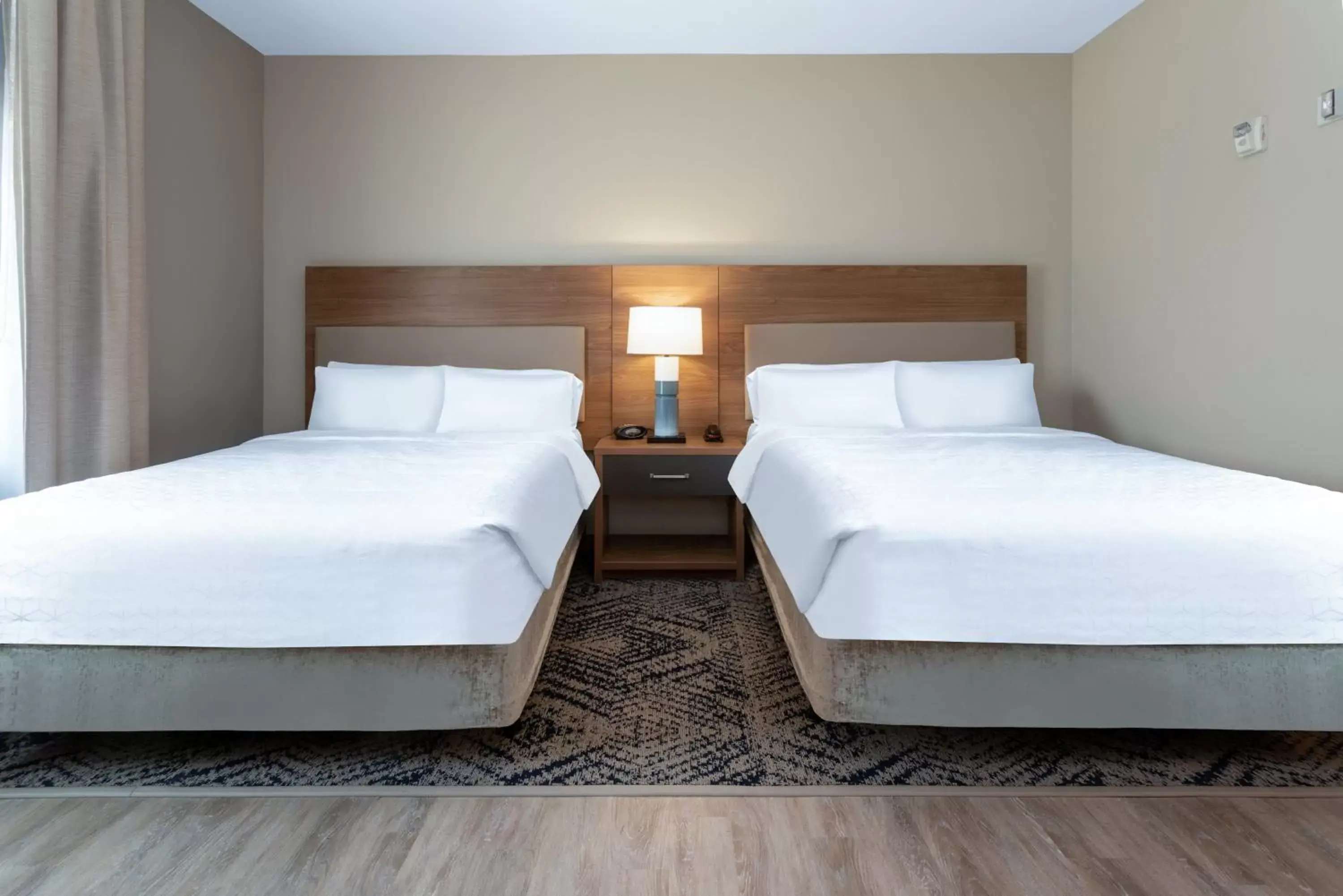 Photo of the whole room, Bed in Candlewood Suites Sioux Falls, an IHG Hotel
