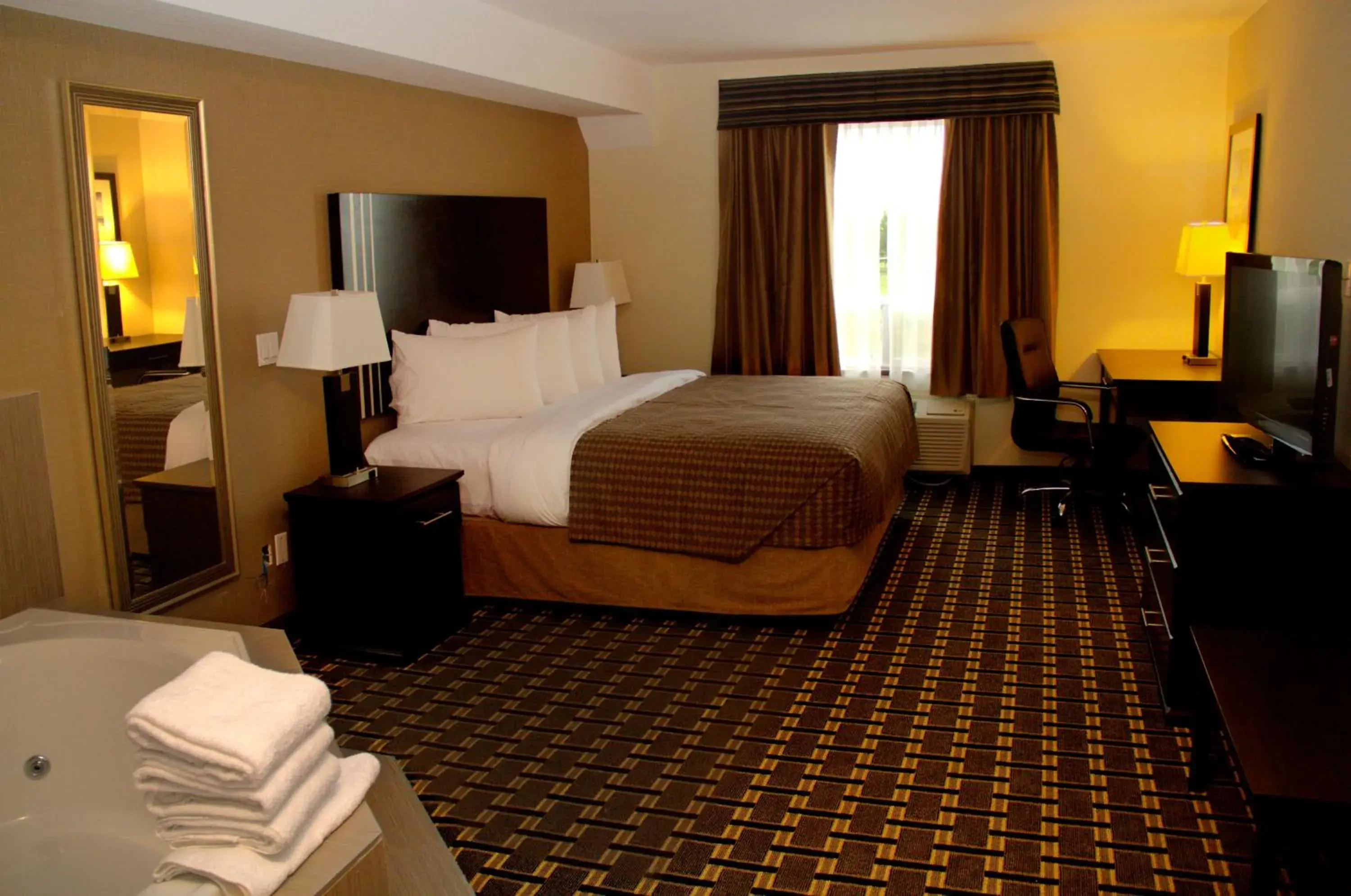 Photo of the whole room, Bed in Sigma Inn & Suites