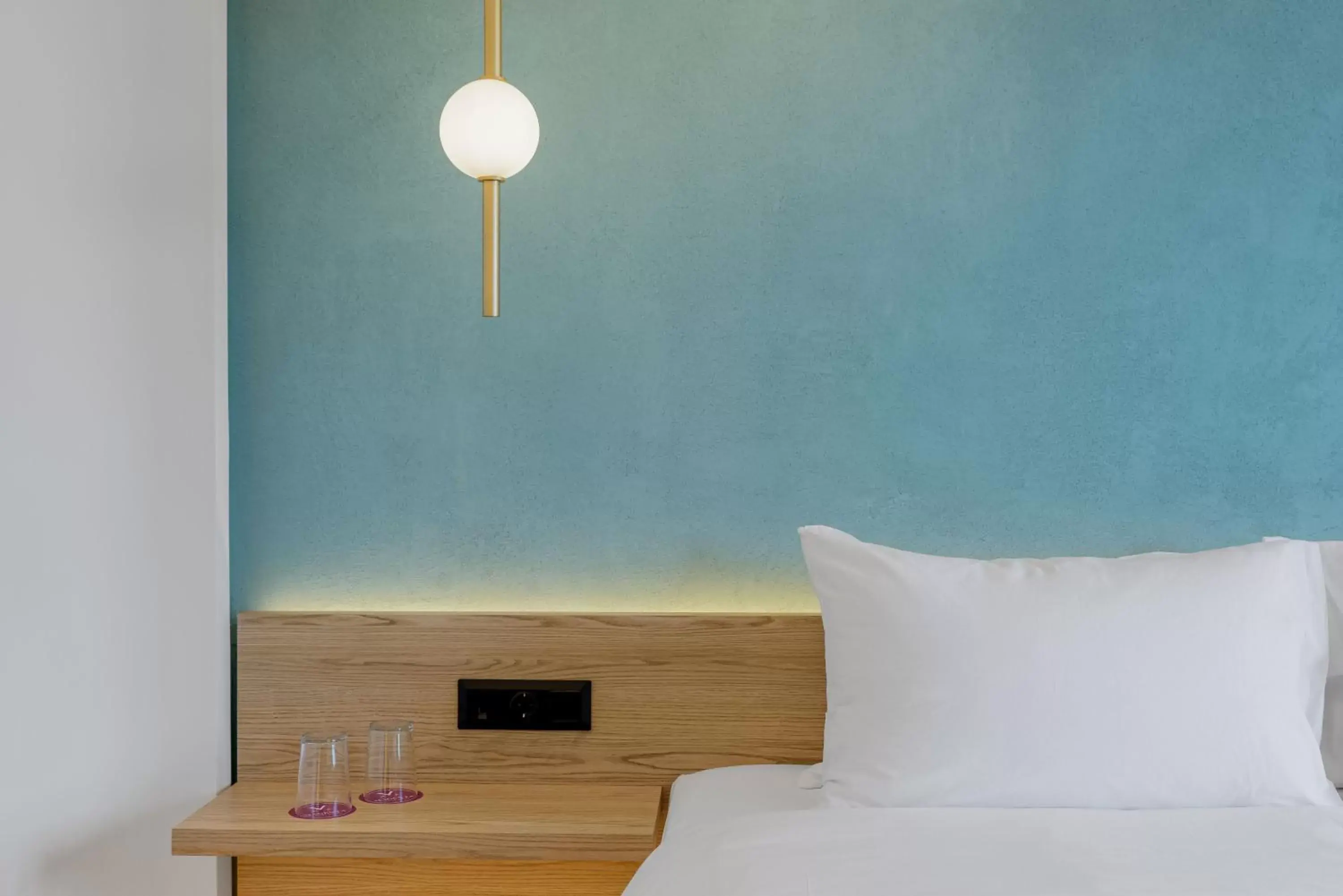 Bed in Acropolis Magenta Luxury Suites