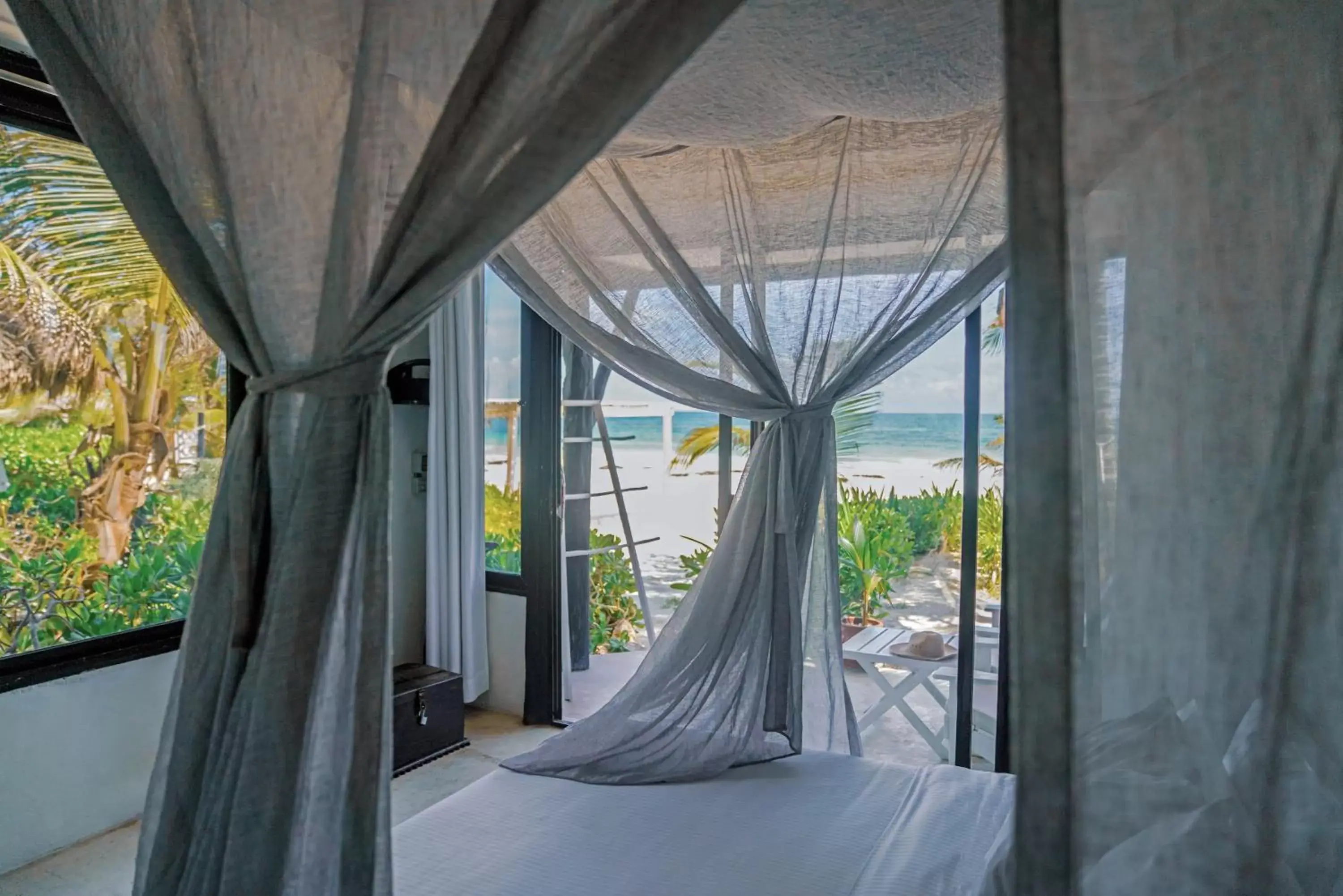 Bed, Balcony/Terrace in Coco Tulum Zen Zone Hotel