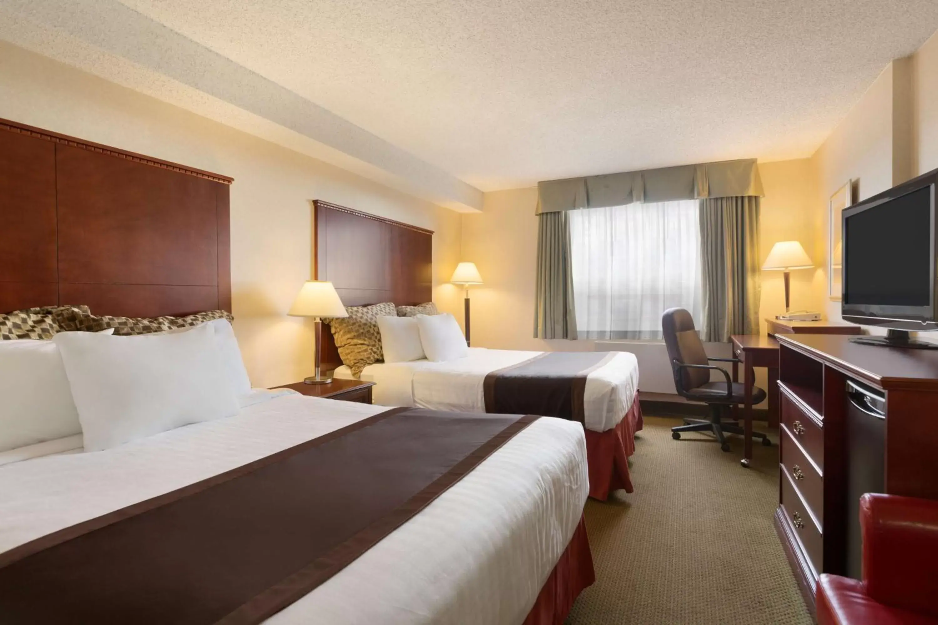 Deluxe Business Queen Room with Two Queen Beds - Non-Smoking in Travelodge Hotel by Wyndham Vancouver Airport