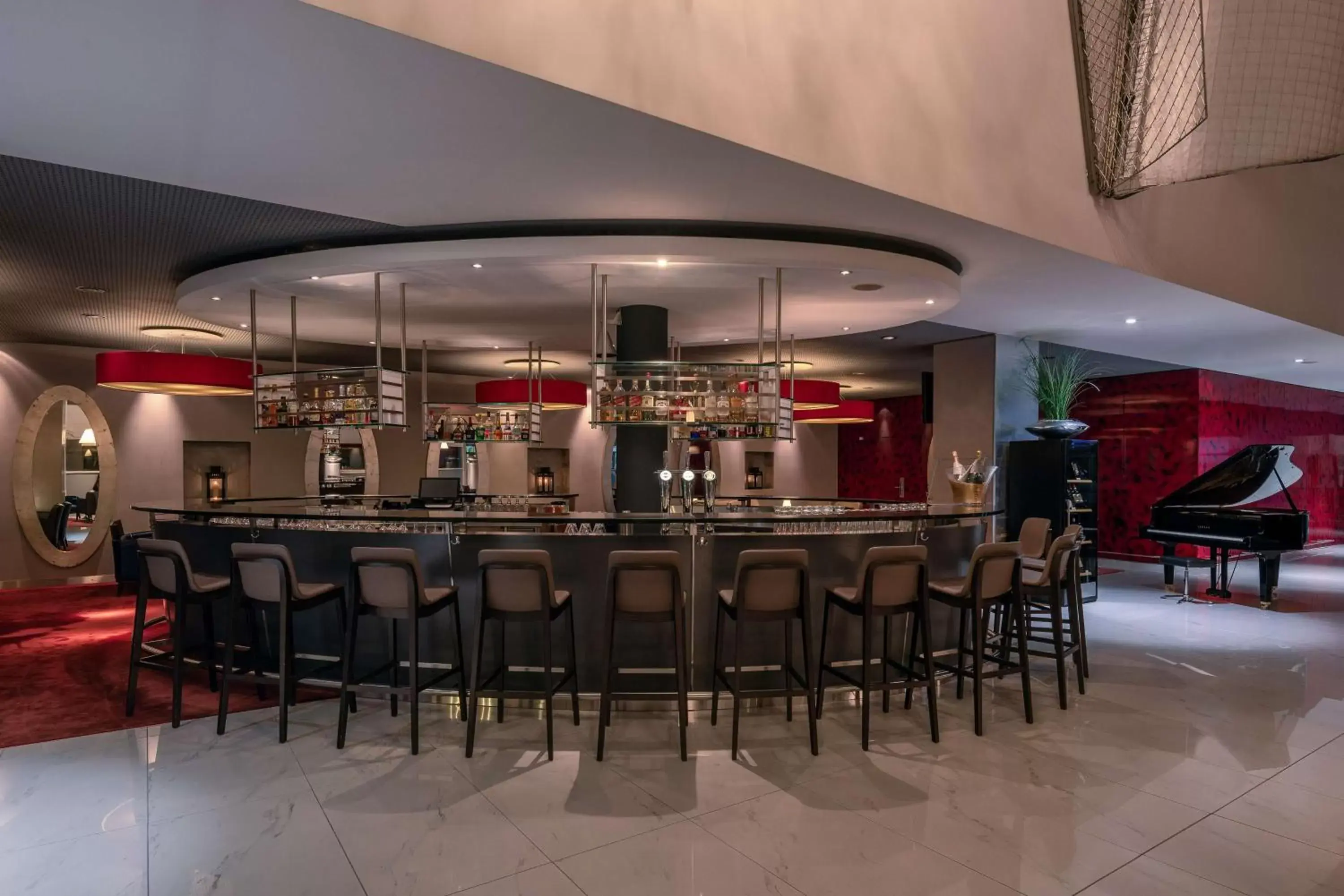 Lounge or bar in Hilton Geneva Hotel and Conference Centre Lounge or bar in Hilton Geneva Hotel and Conference Centre