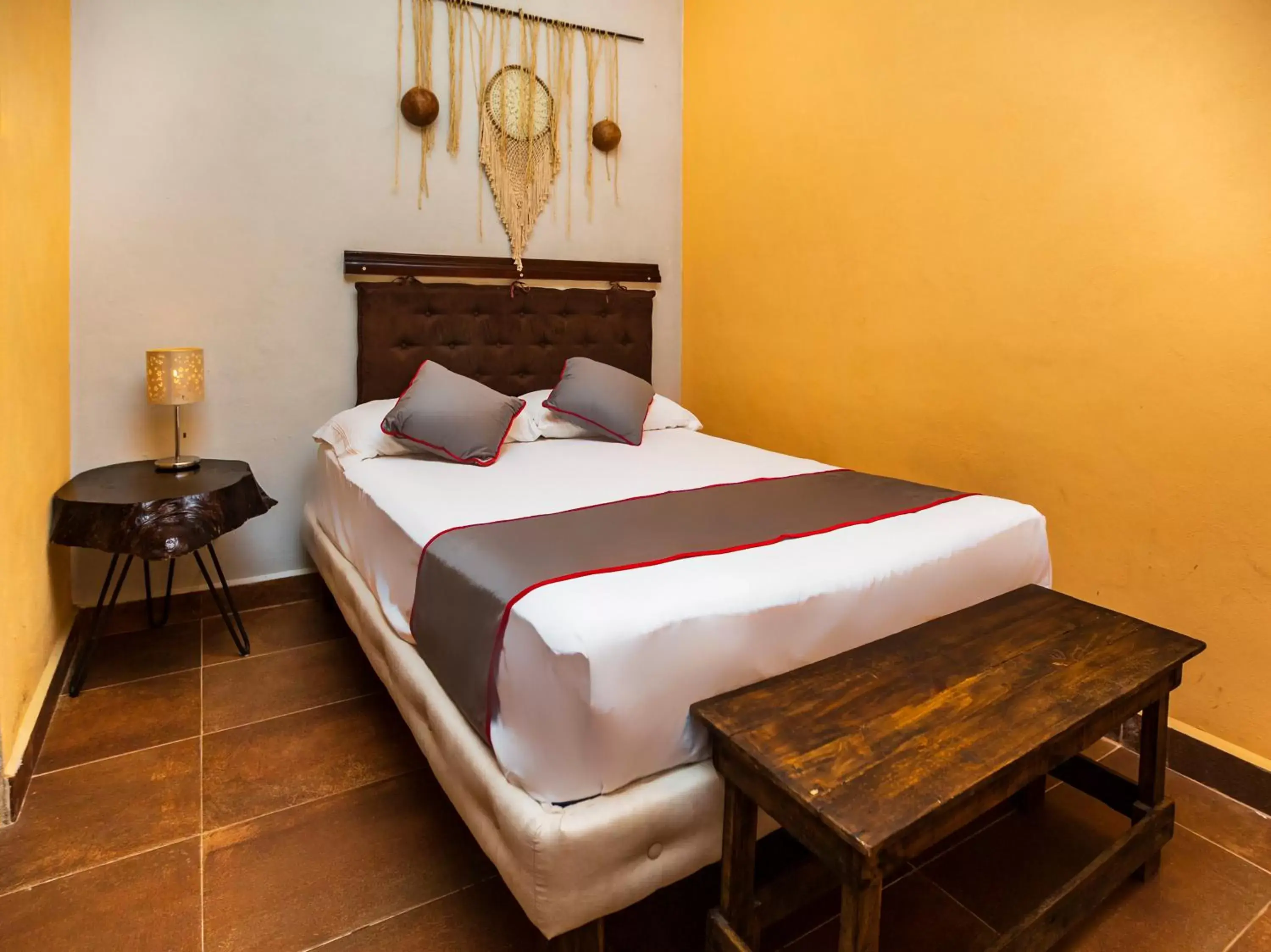 Bed in Casa Aluxes Hotel