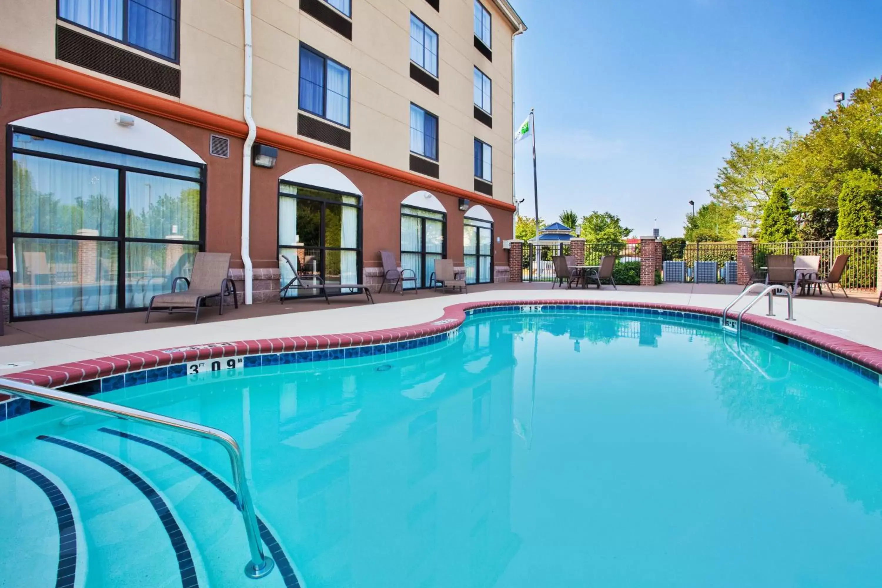 Swimming Pool in Holiday Inn Express & Suites Charlotte-Concord-I-85, an IHG Hotel