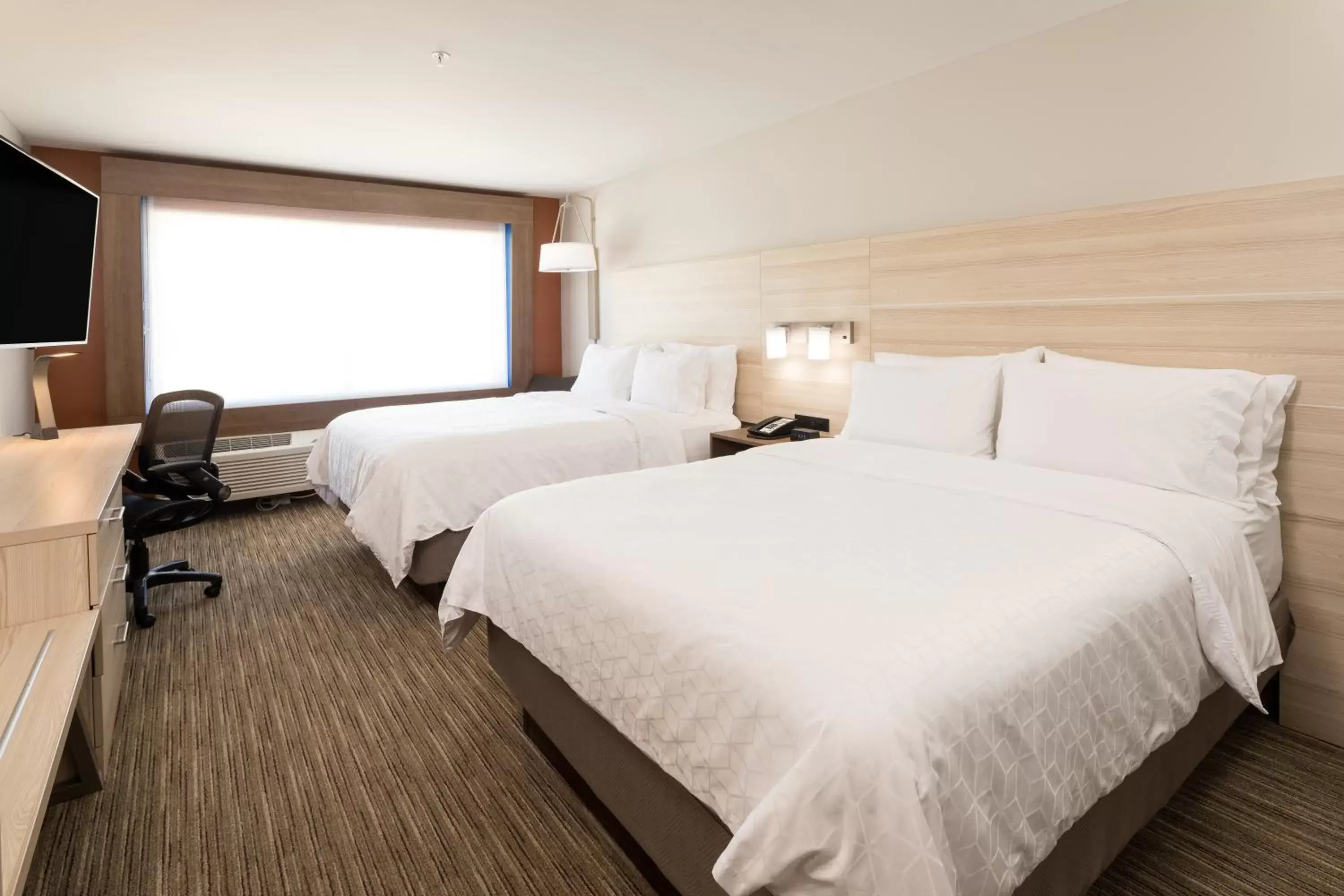 Bed in Holiday Inn Express & Suites - Michigan City, an IHG Hotel