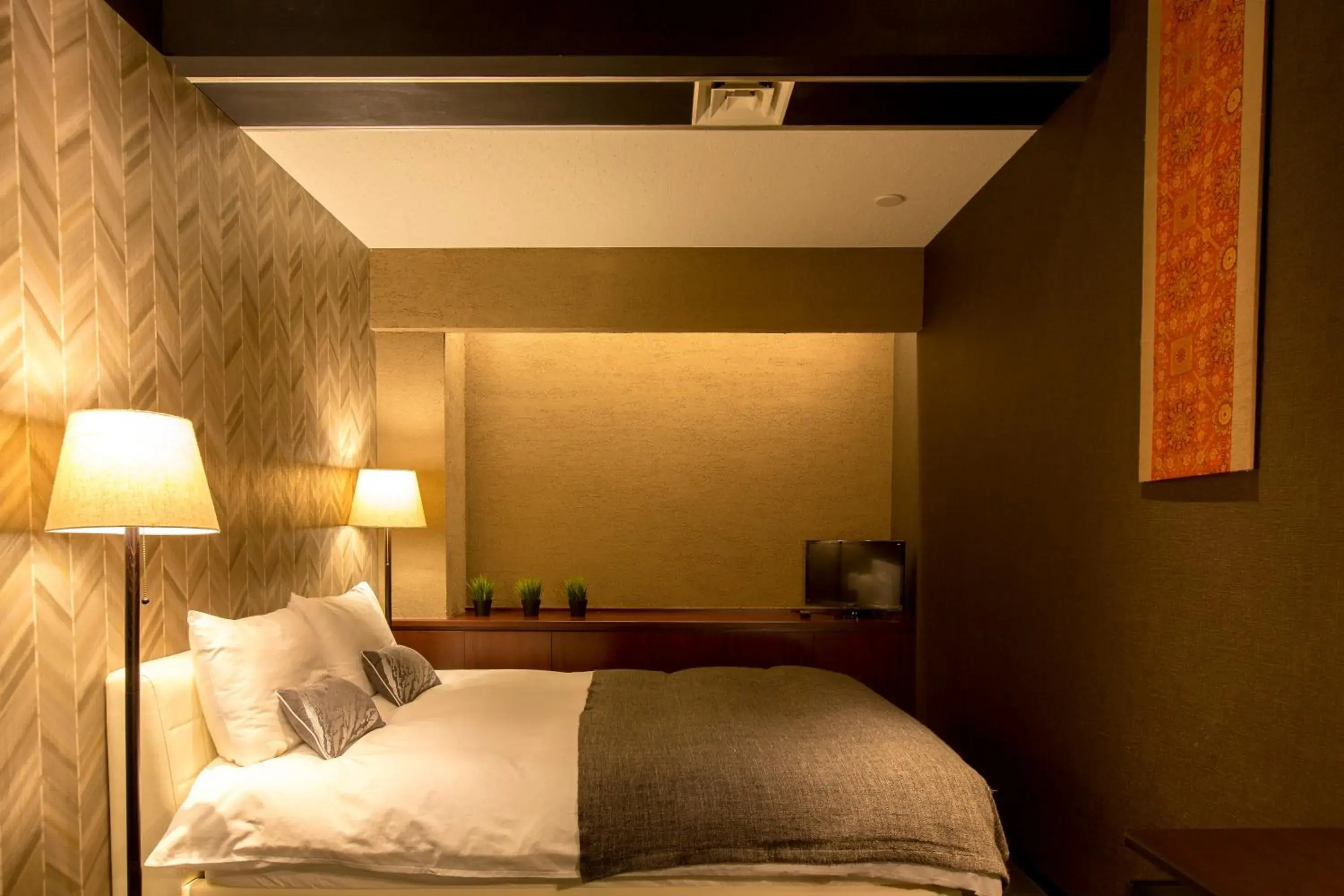 Bed in R&Run Kyoto Serviced Apartment & Suites