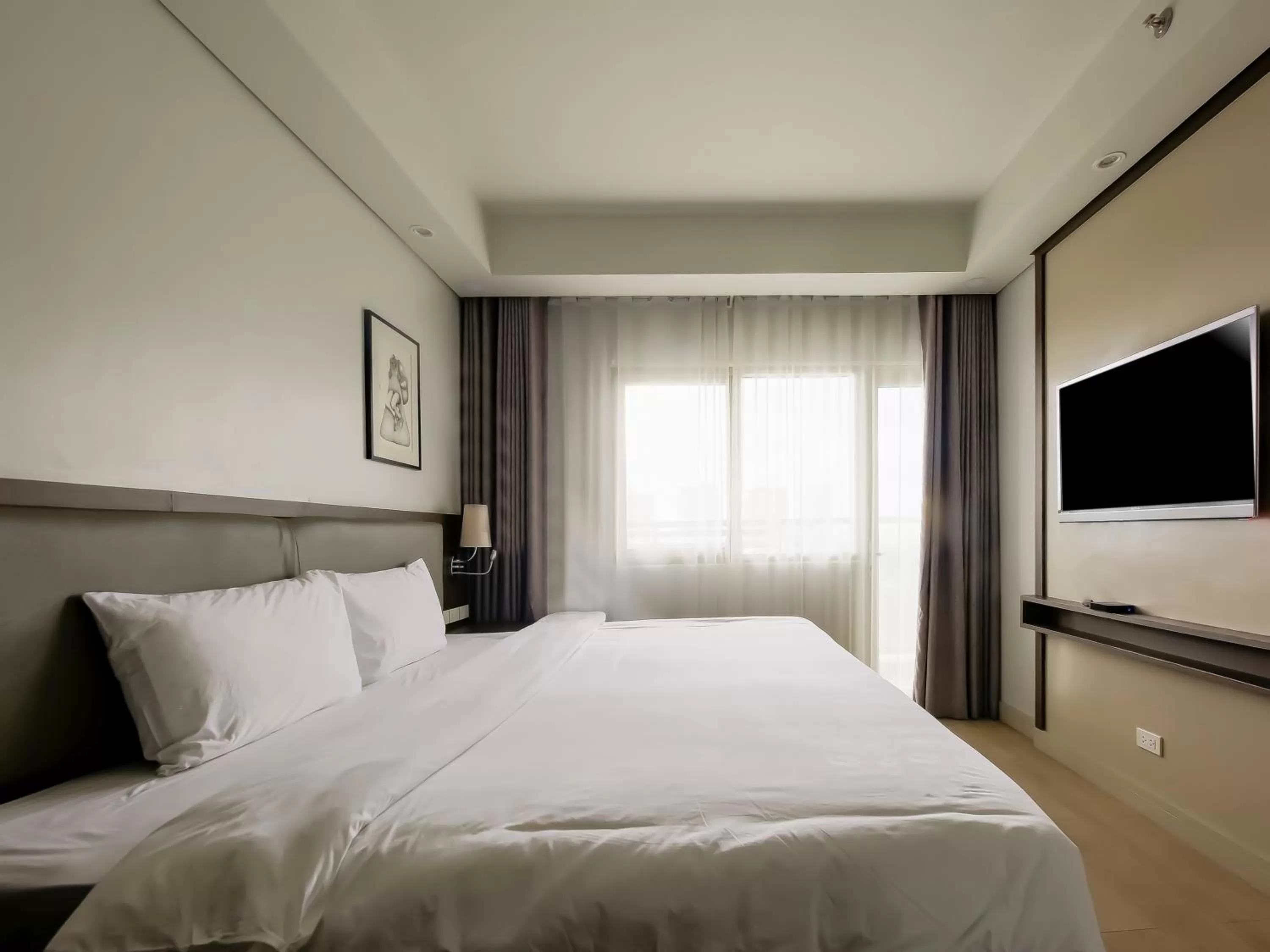 Photo of the whole room, Bed in Capital O 804 The Residences at Bonifacio Civic Center