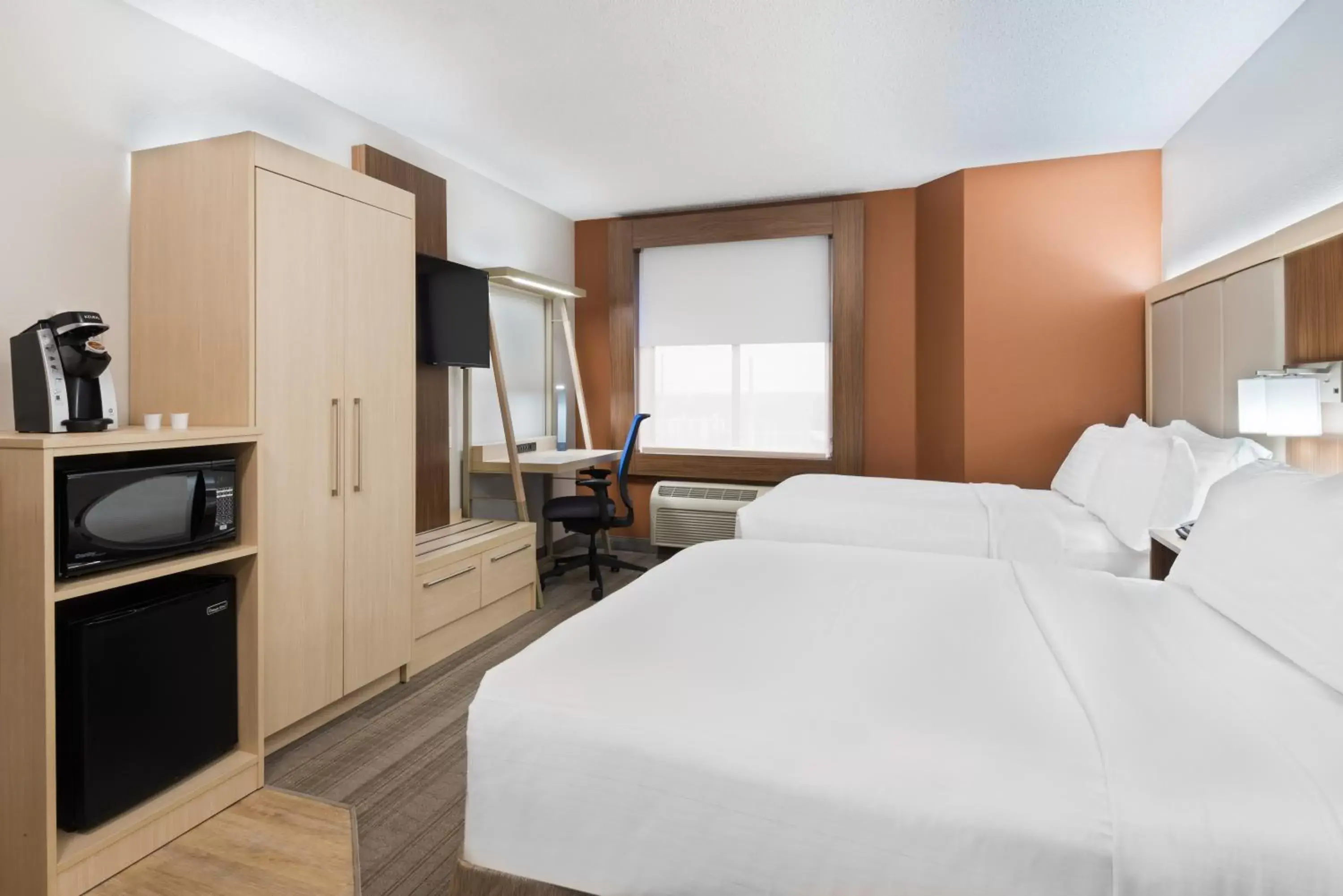 Bedroom in Holiday Inn Express & Suites - Nearest Universal Orlando, an IHG Hotel