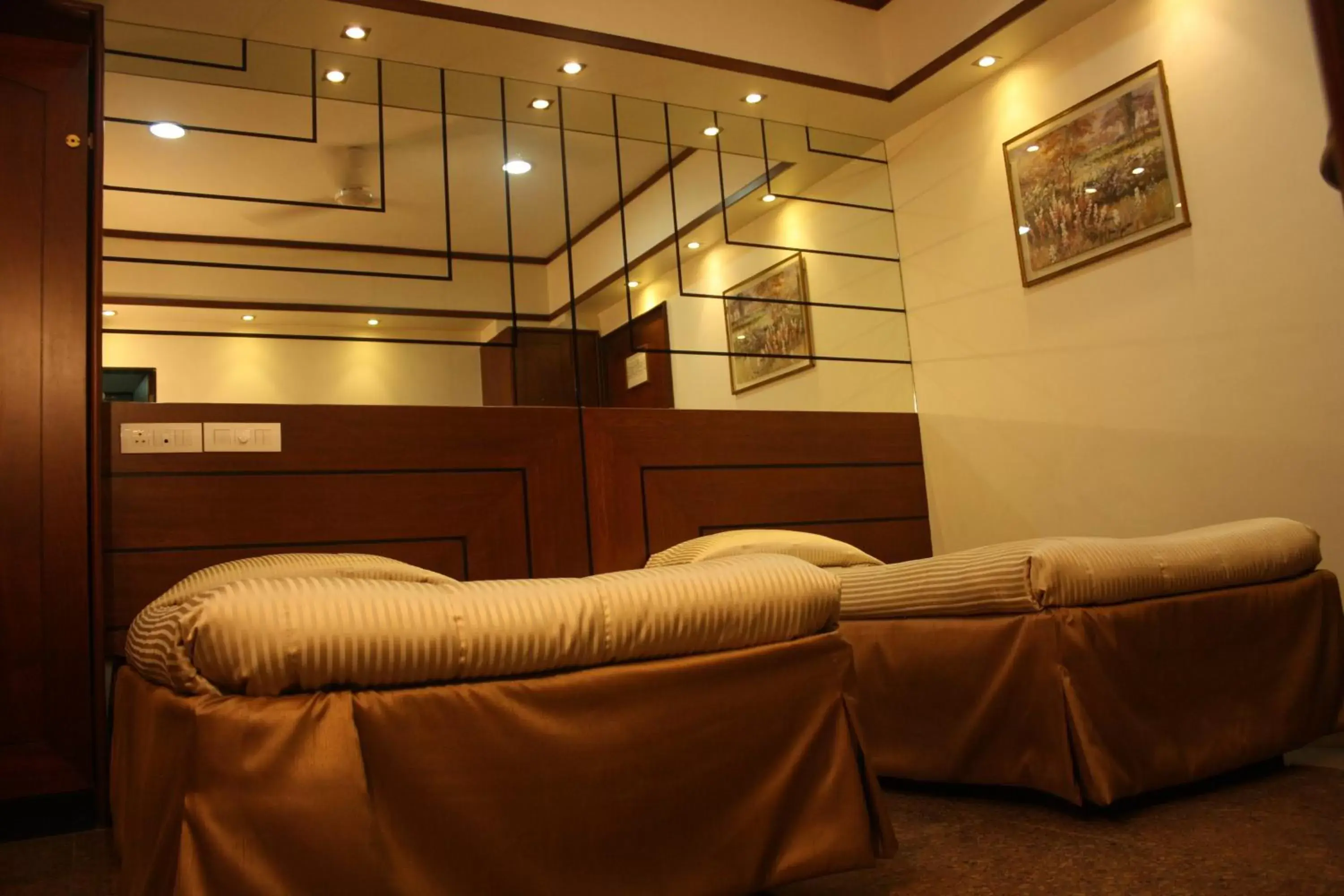 Bed, Seating Area in Hotel Karl Residency