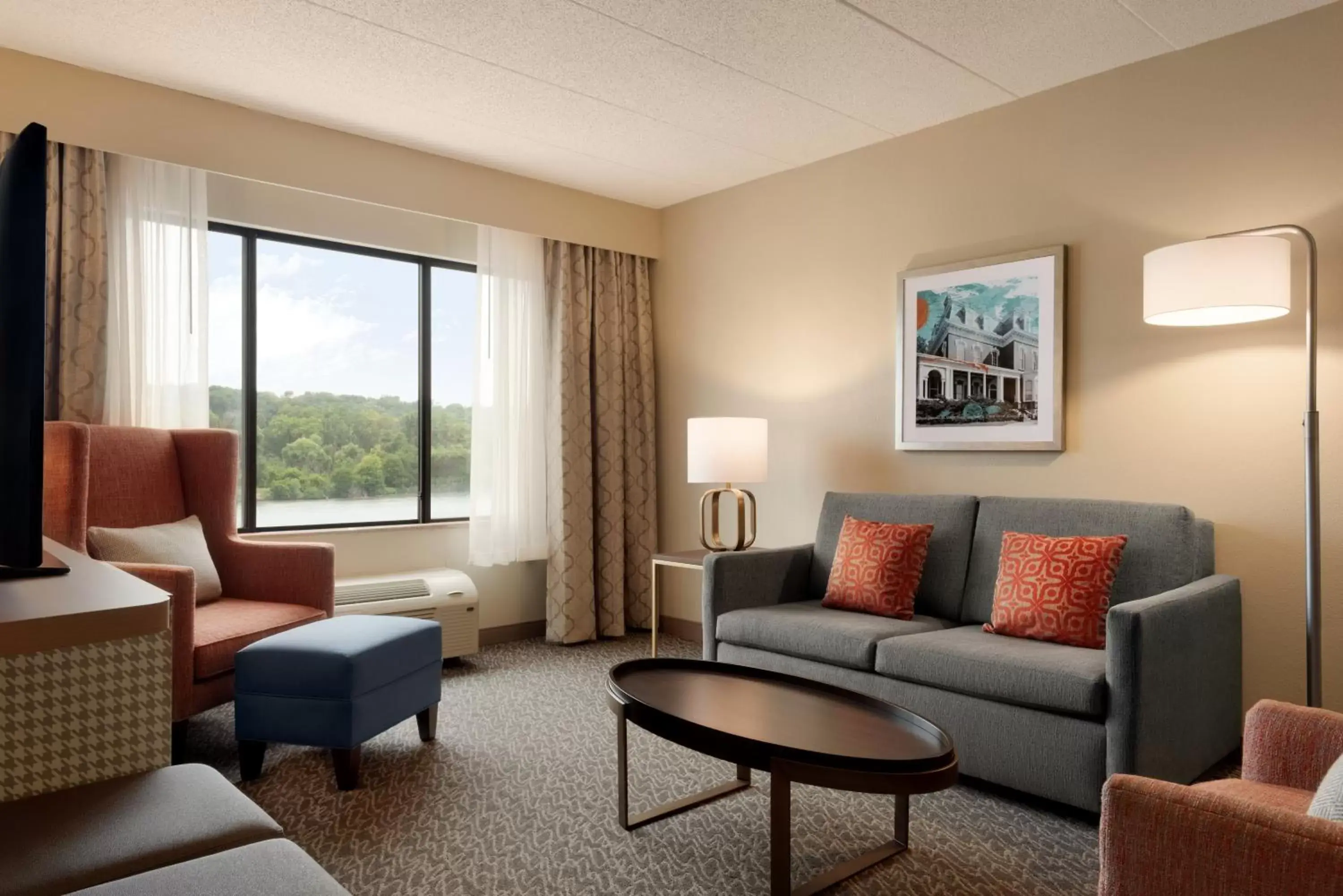 Bedroom, Seating Area in Holiday Inn Hotel & Suites Council Bluffs, an IHG Hotel