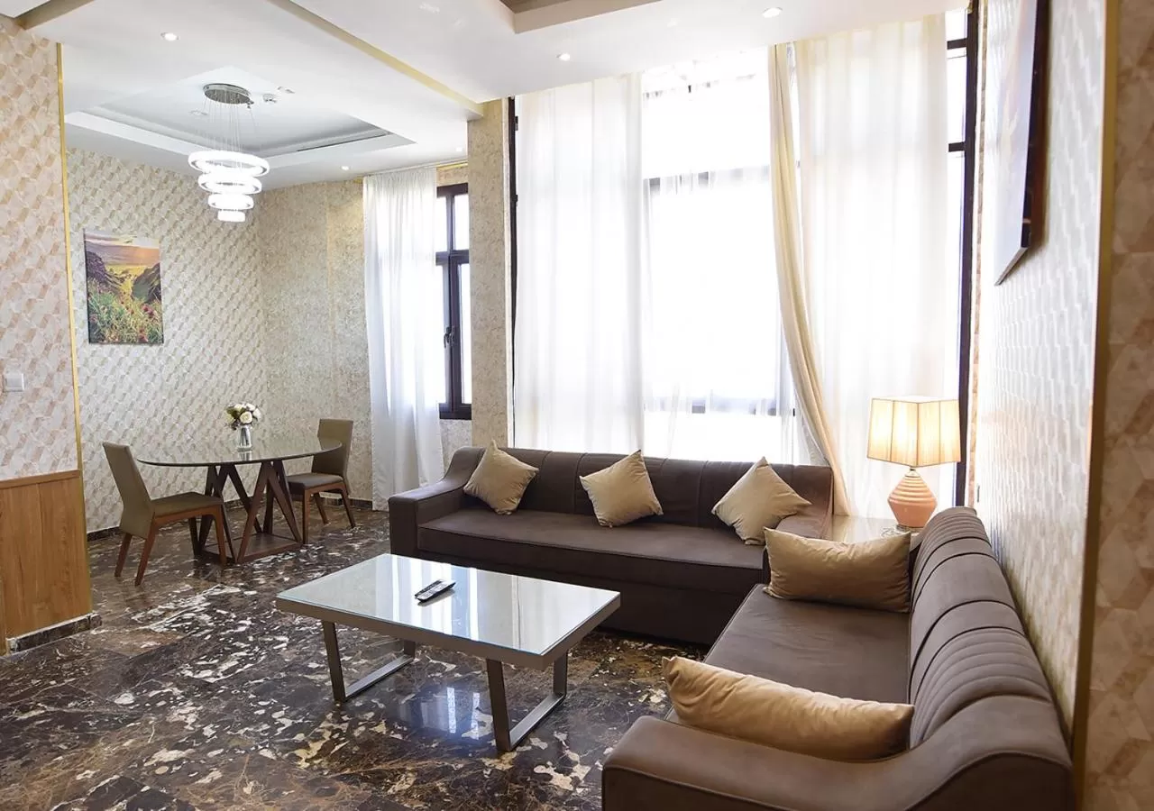 Communal lounge/ TV room, Seating Area in Rihanna Hotel Apartment