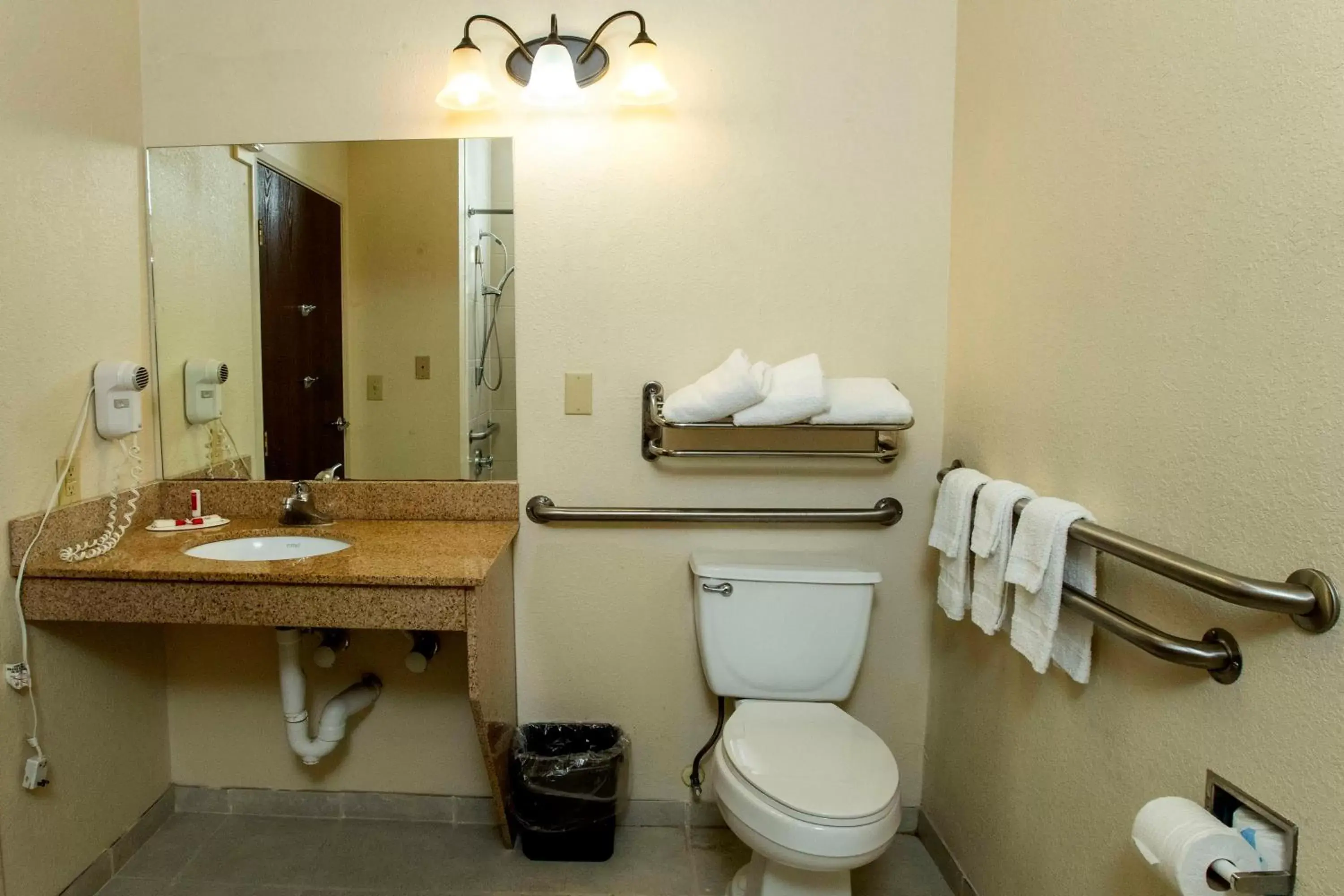 Toilet, Bathroom in Days Inn & Suites by Wyndham Houston North/Aldine