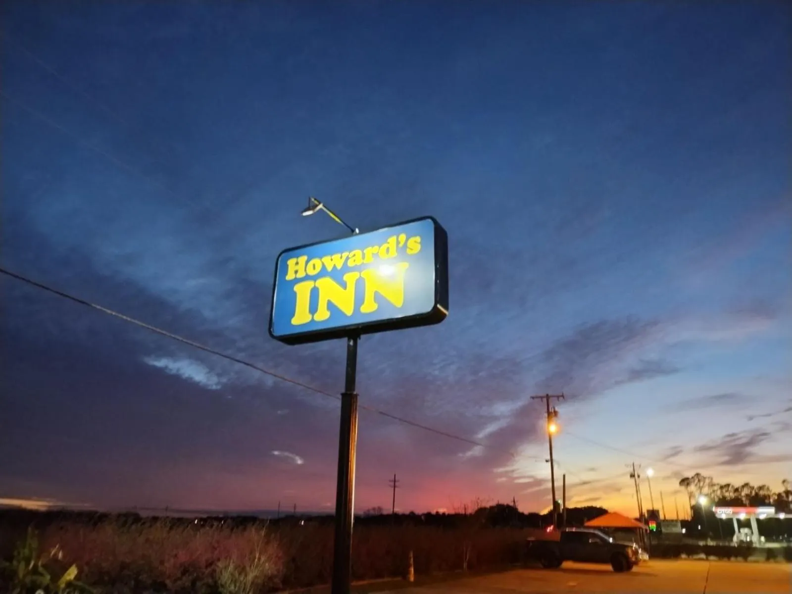 Property logo or sign in Howards Inn Motel