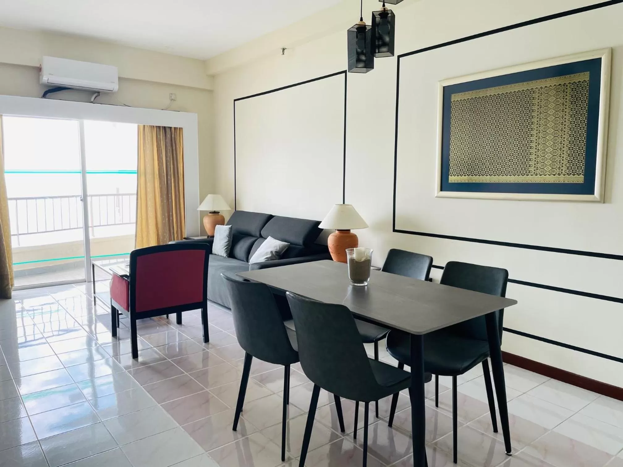 Living room, Dining Area in Seaview Suite at Rainbow Paradise