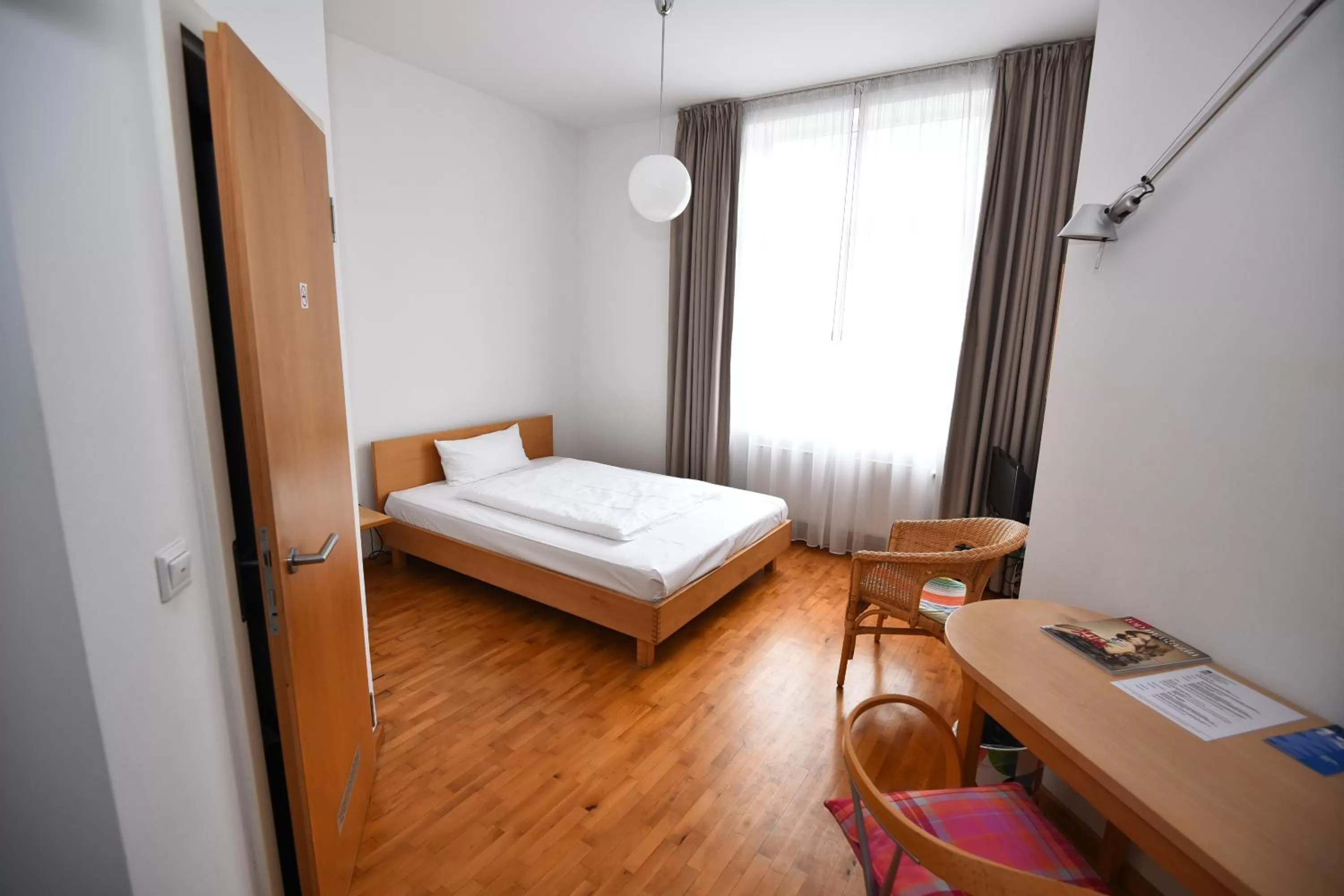 Bed in Art-Hotel Robert Mayer