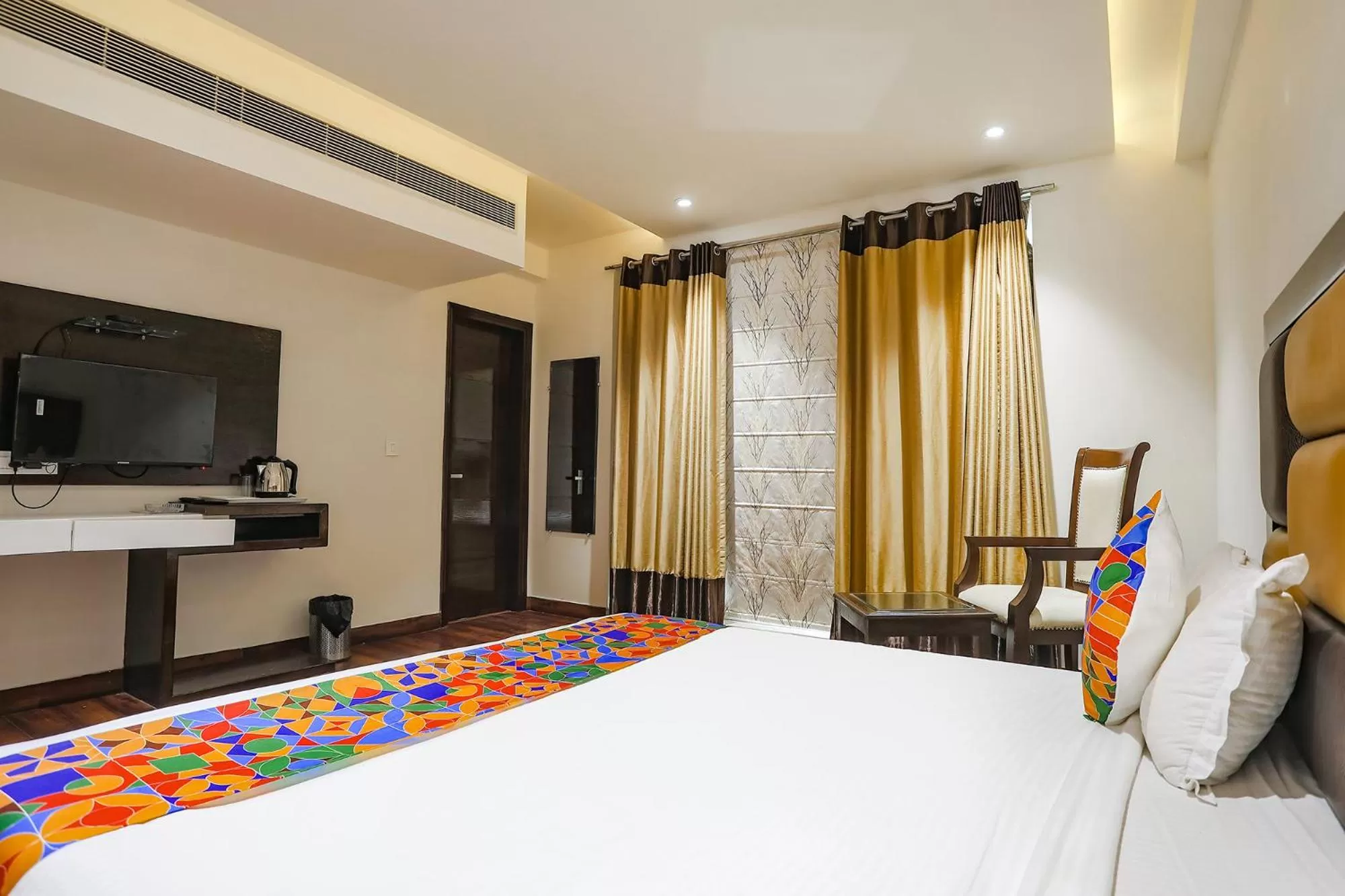 Communal lounge/ TV room, Bed in FabHotel Grand Stay