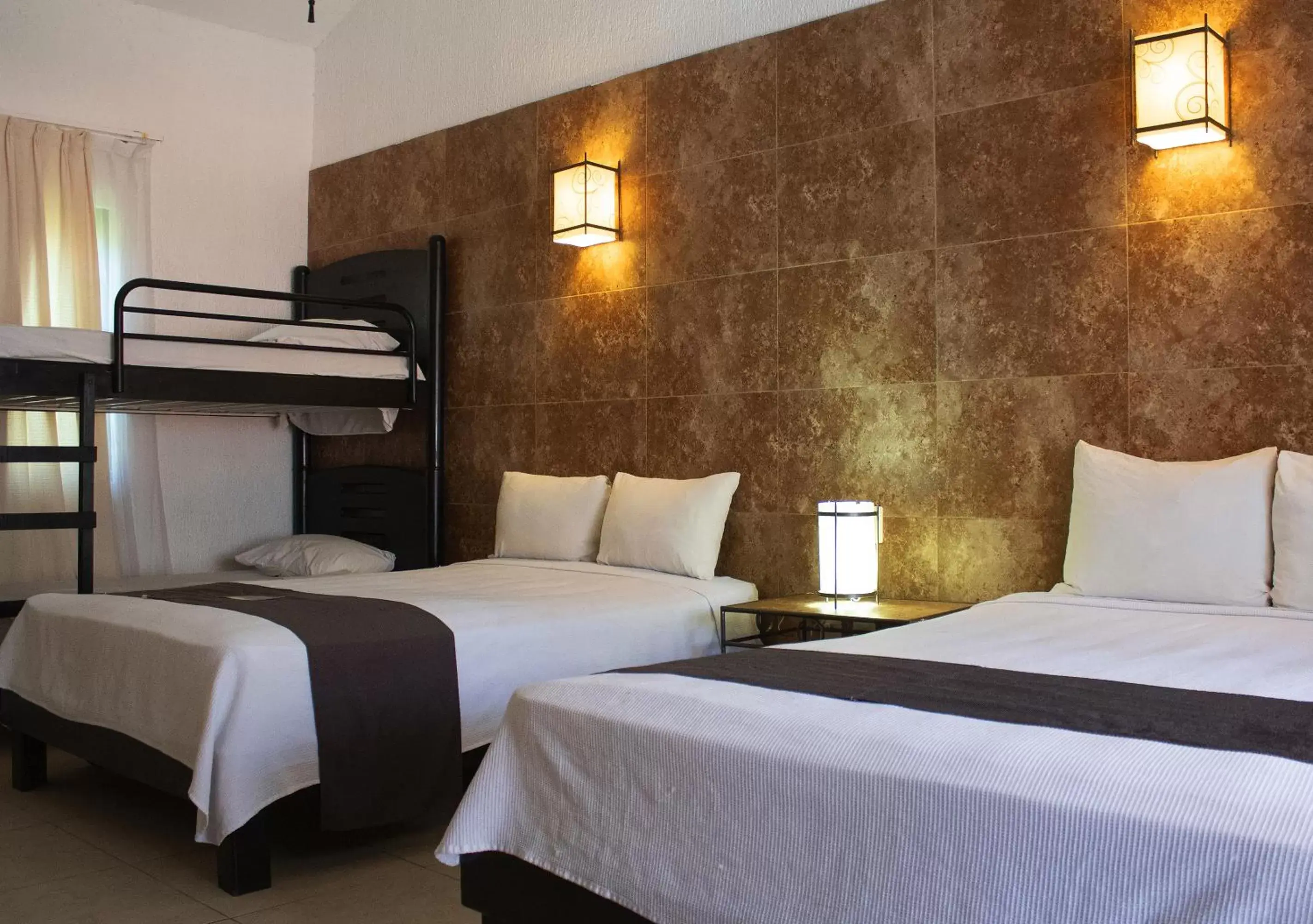 Bed in Tukan Hotel Playa del Carmen