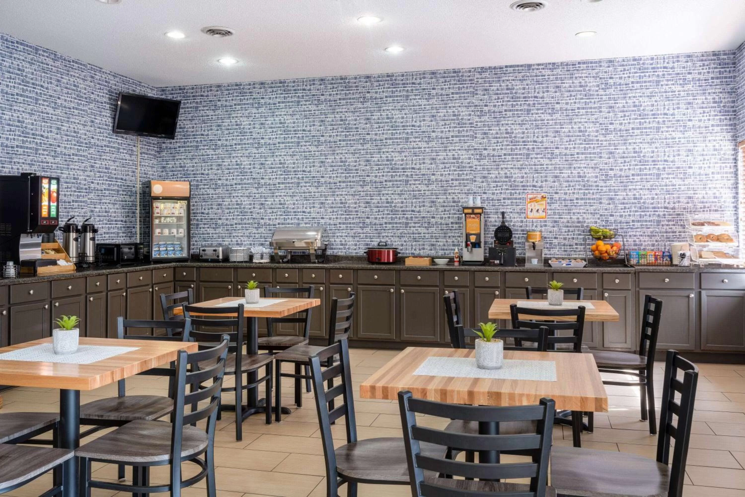 Seating area in AmericInn by Wyndham Cedar Rapids North