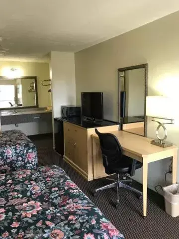 Bedroom, TV/Entertainment Center in WESTERN MOTEL