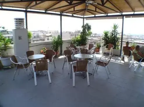 Balcony/Terrace, Restaurant/Places to Eat in Economy Hotel
