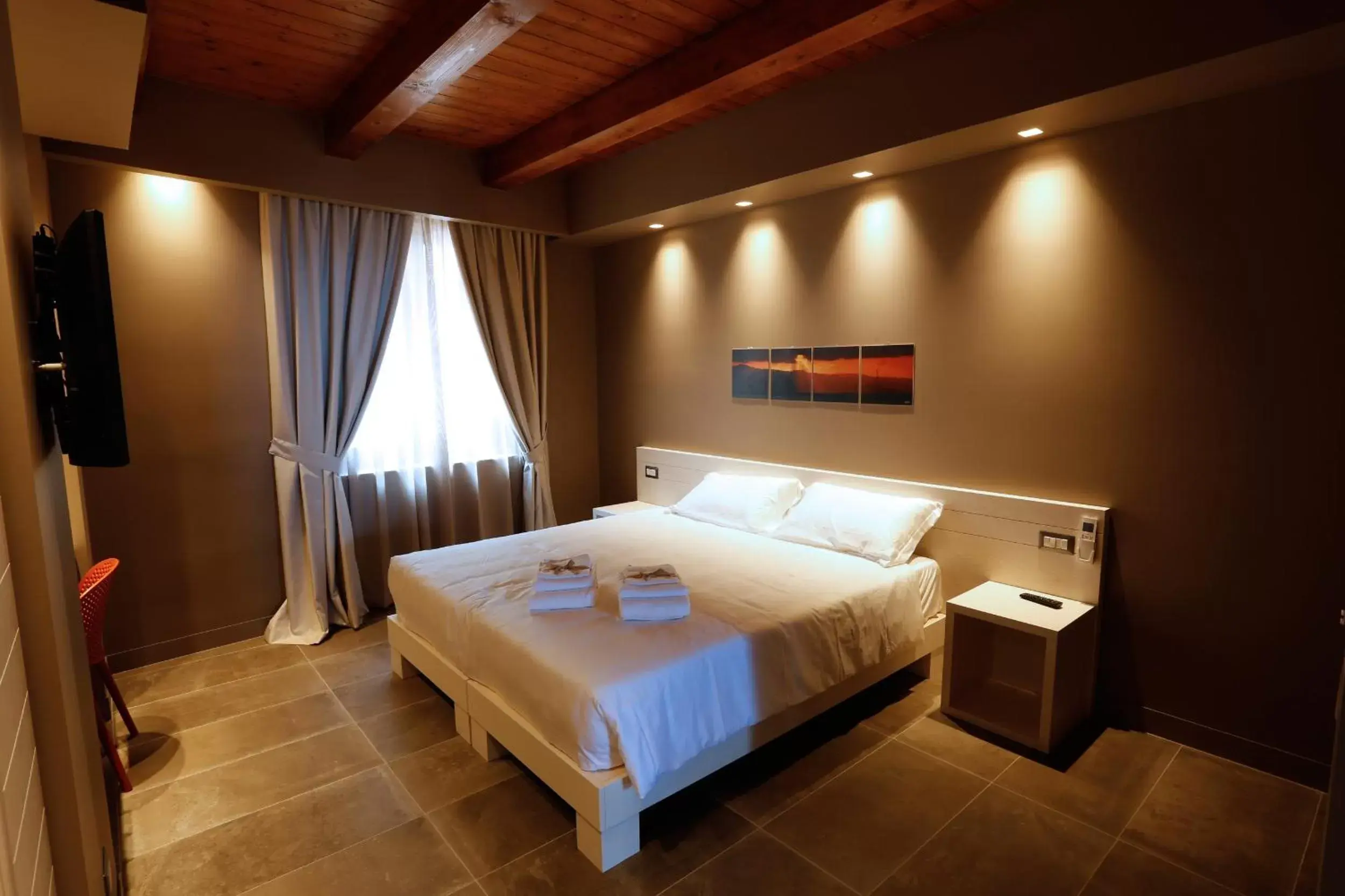 Bed in Il Casato Deluxe Rooms