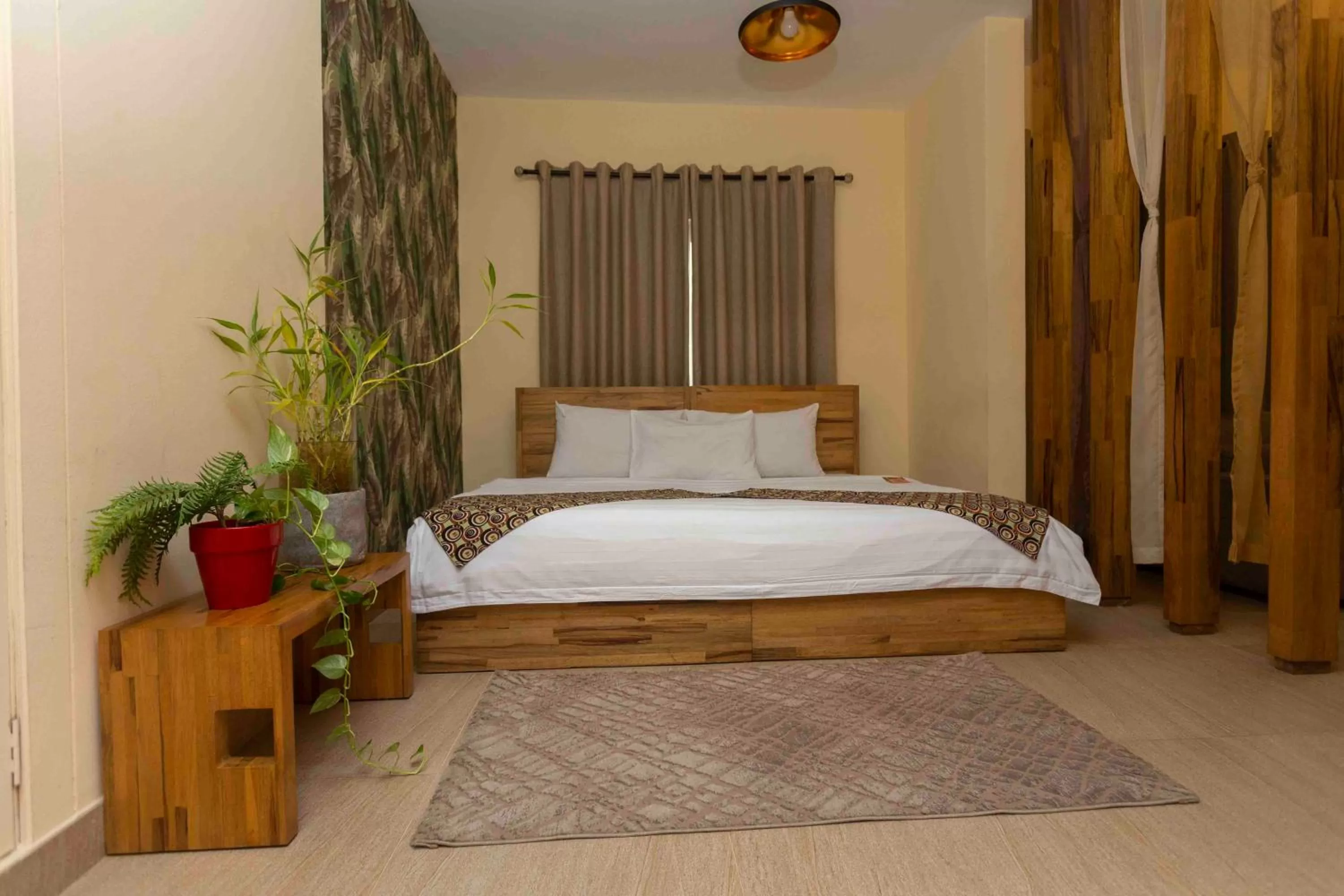 Bed in Roots Hotel Apartment