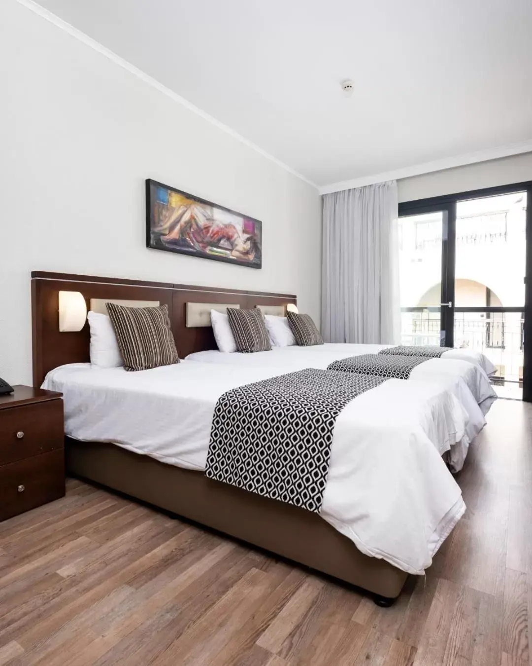 Bed in Livadhiotis City Hotel