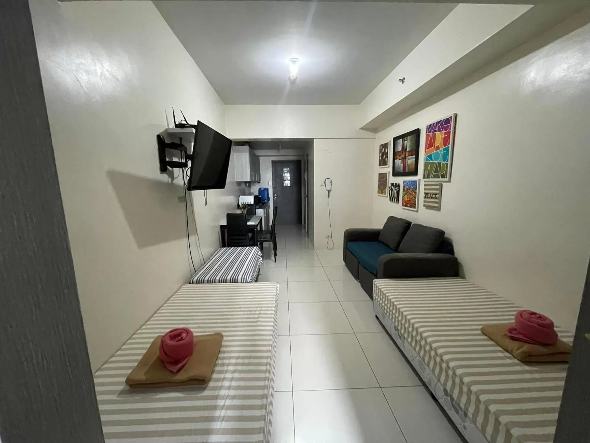 Bed, Seating Area in Green Residences Staycation by PBYY