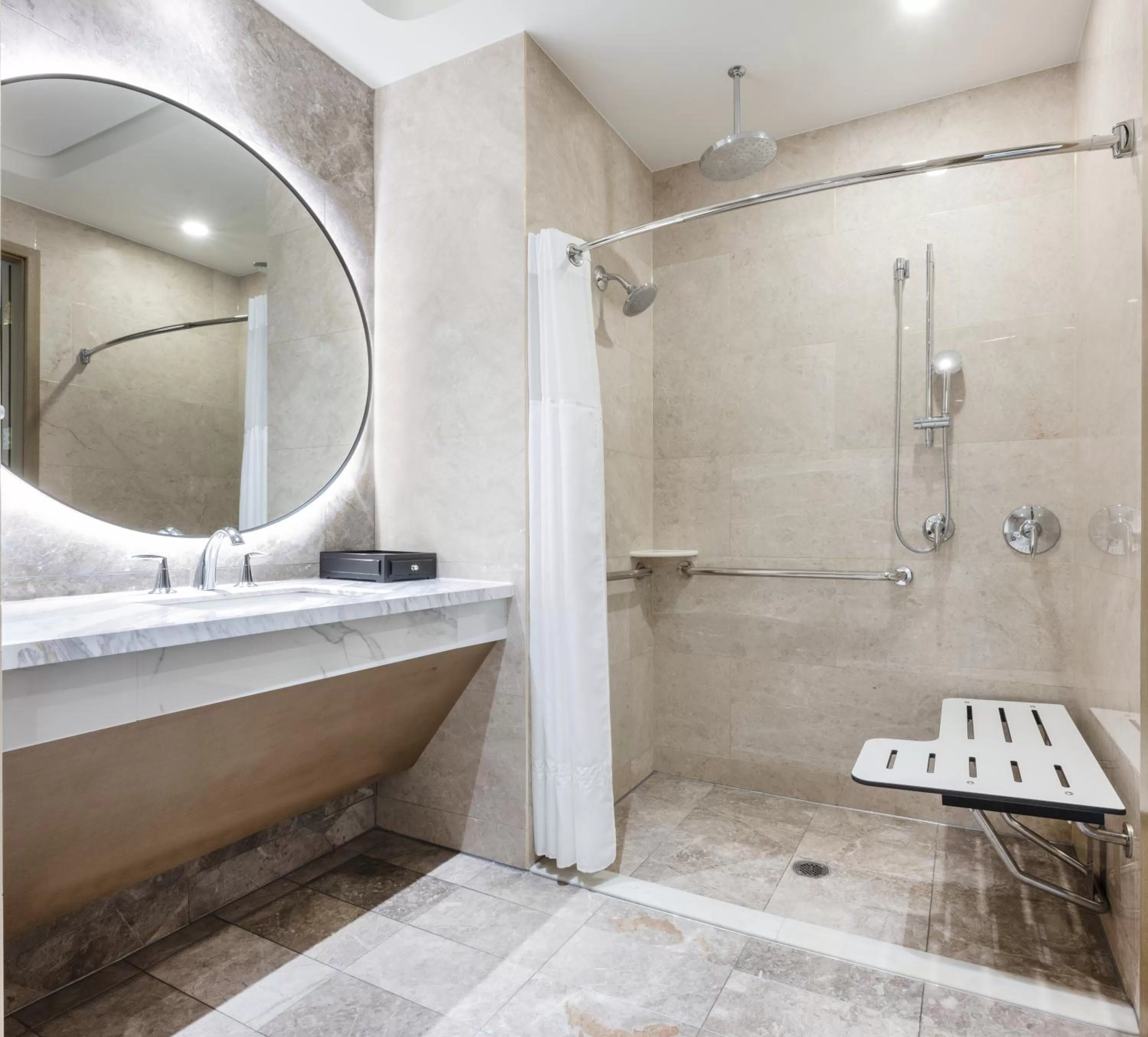 Bathroom in Blossom Hotel Houston, Curio Collection by Hilton