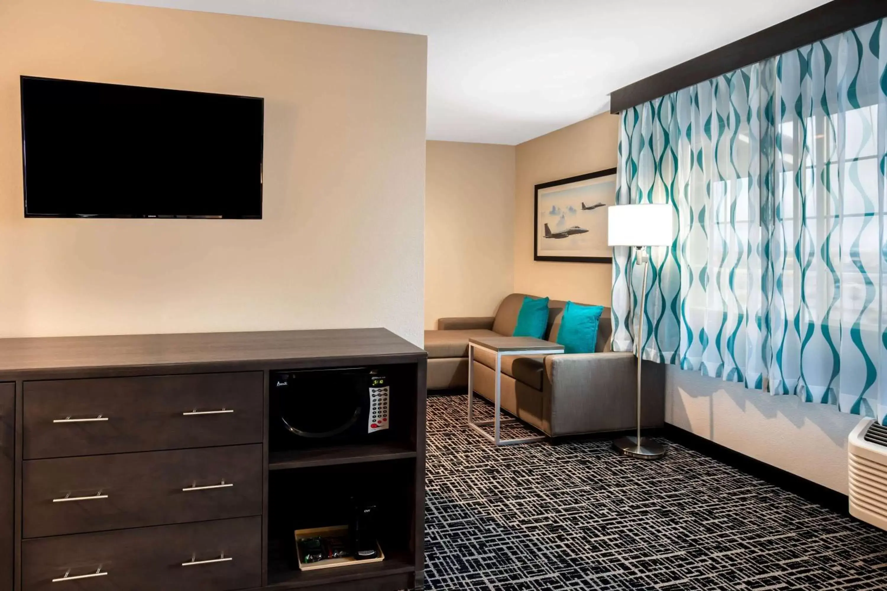 Photo of the whole room, TV/Entertainment Center in La Quinta Inn & Suites by Wyndham Las Vegas Nellis