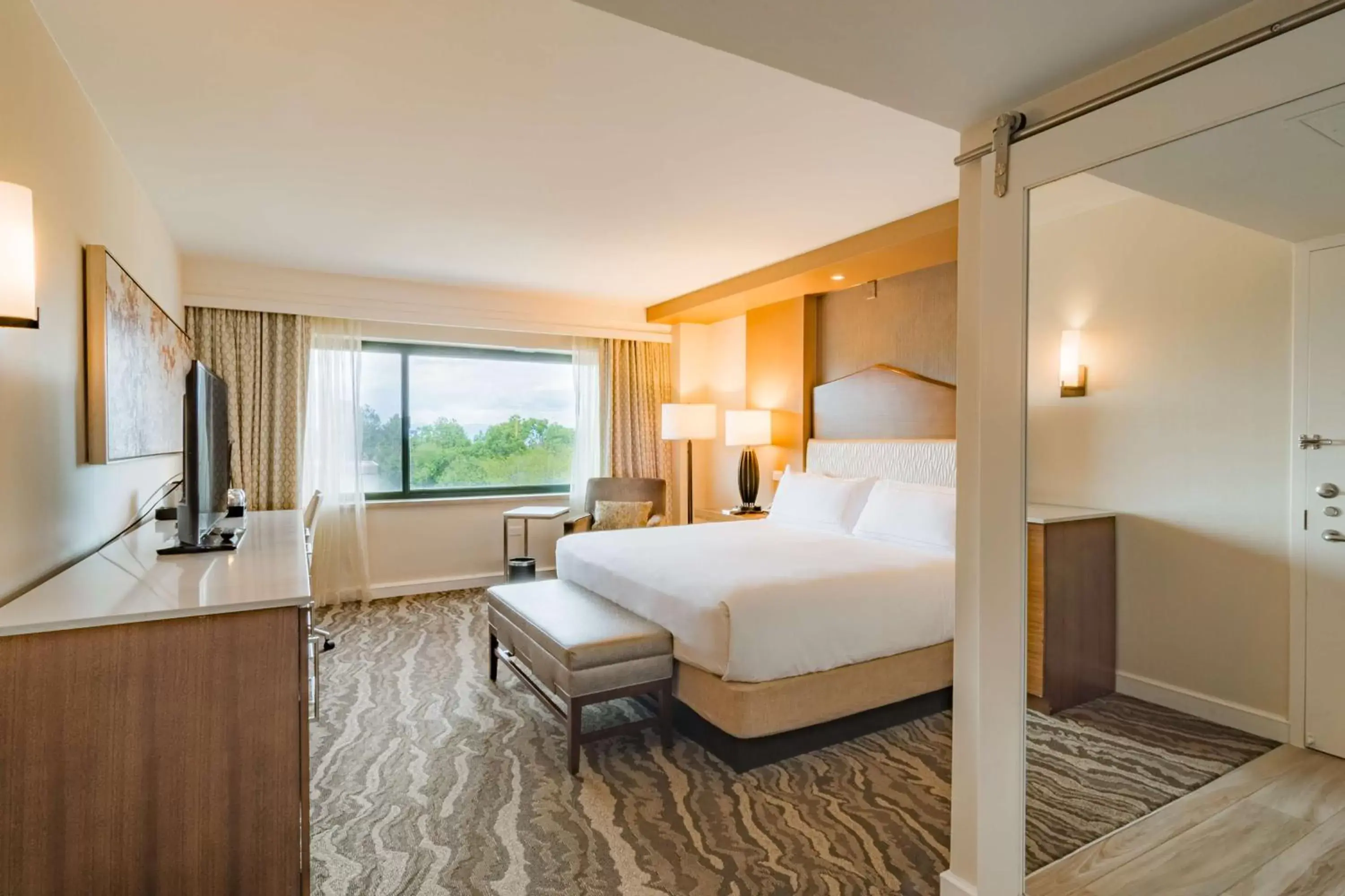 Bed in The Inverness Denver, a Hilton Golf & Spa Resort