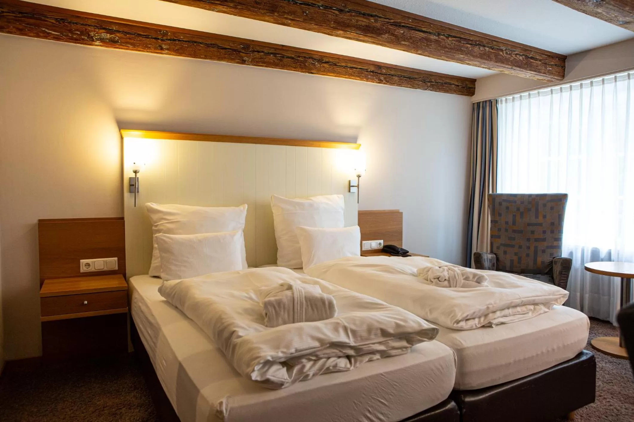 Bed in Romantik Hotel Aquarium