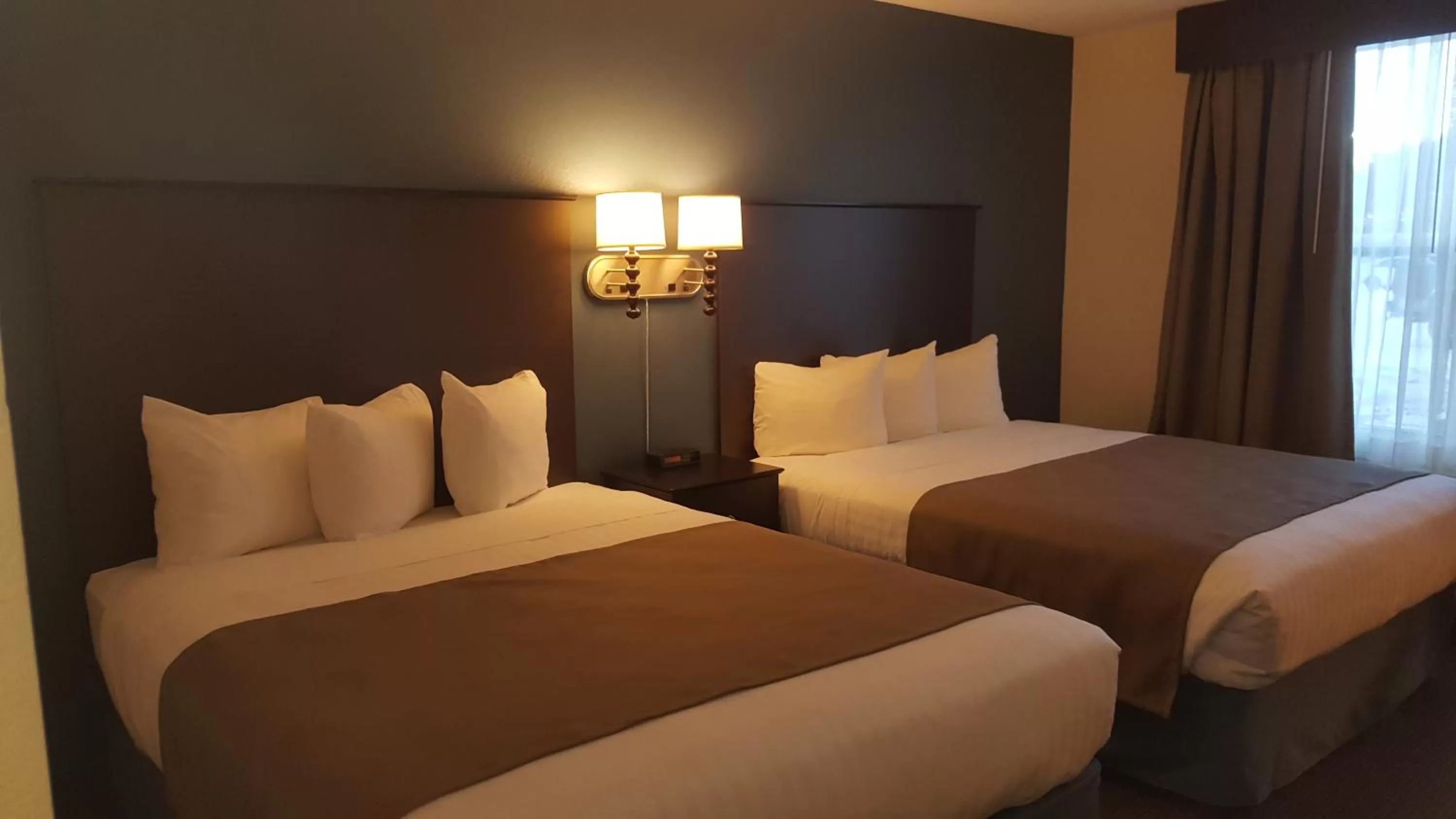 Bed in AmericInn & Suites Burnsville, MN