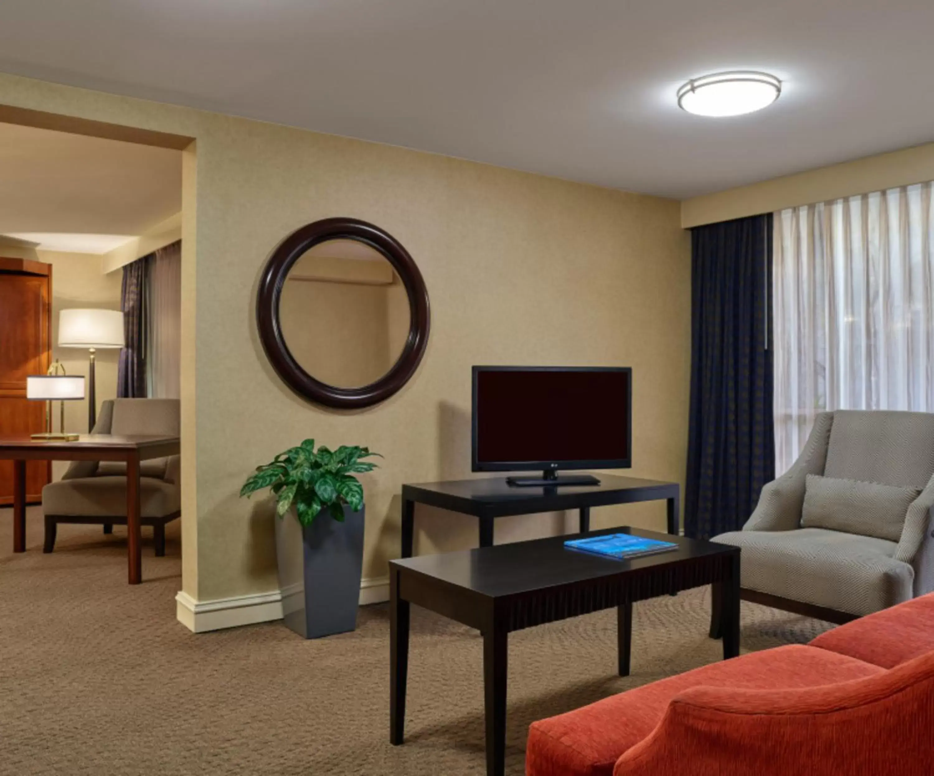 Living room, TV/Entertainment Center in Courtland Grand Hotel, Trademark Collection by Wyndham