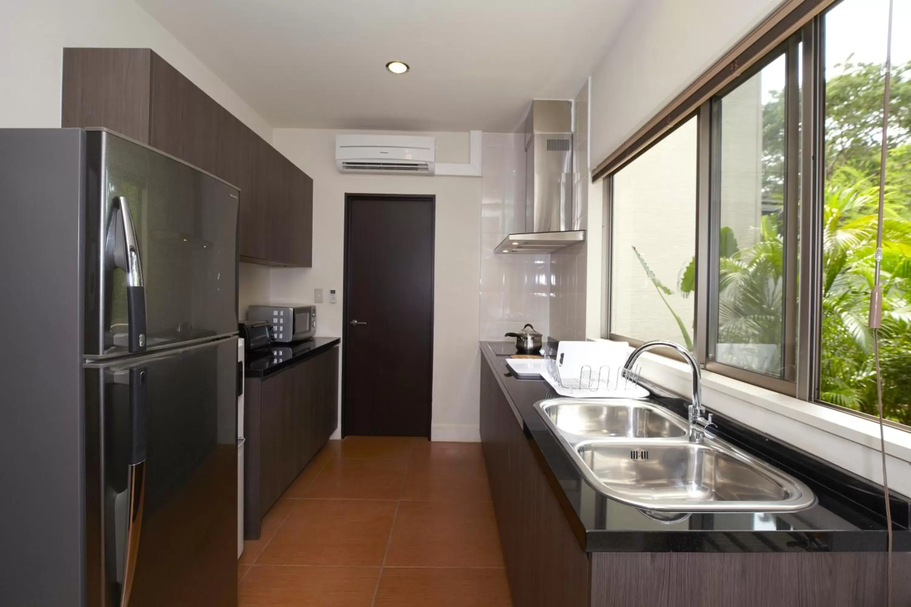 Kitchen or kitchenette, Kitchen/Kitchenette in Axia South Cikarang Service Apartment