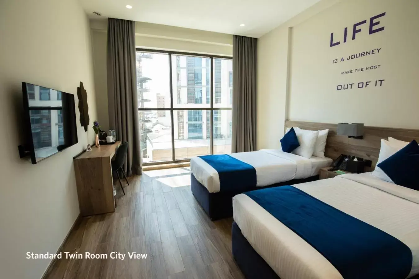 Standard Twin Room City View in Grand Kingsgate Waterfront Hotel by Millennium