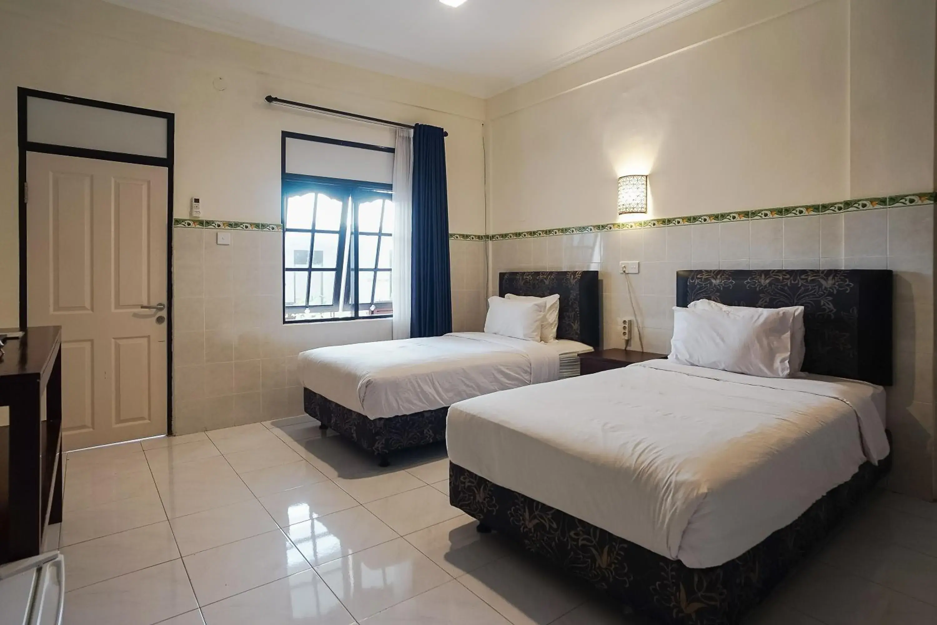 Bed in City Garden Bali Dwipa Hotel