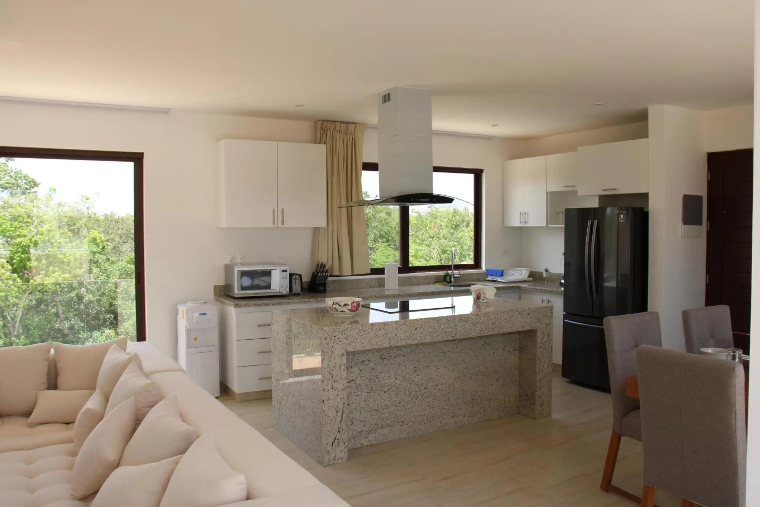 Living room, Kitchen/Kitchenette in Apartment and Penthouse Blue Luxury Kukulkan Tulum