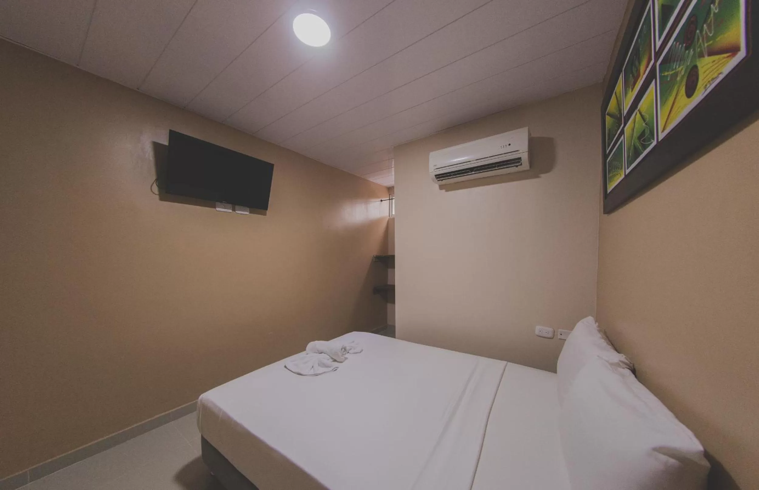 Bed in Hotel Boquilla Suites By GEH Suites