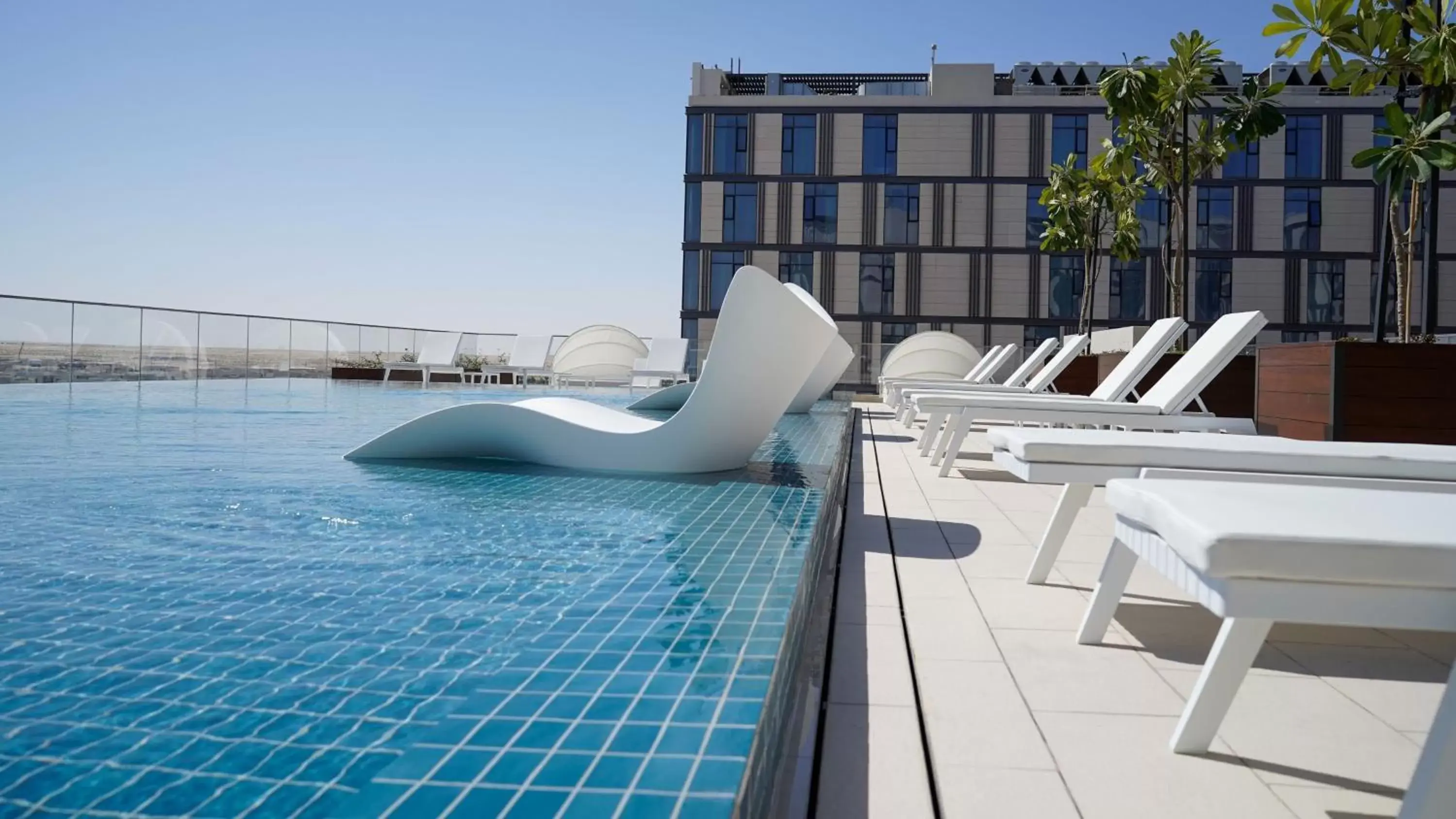 Swimming Pool in Staybridge Suites Dubai Al-Maktoum Airport, an IHG Hotel