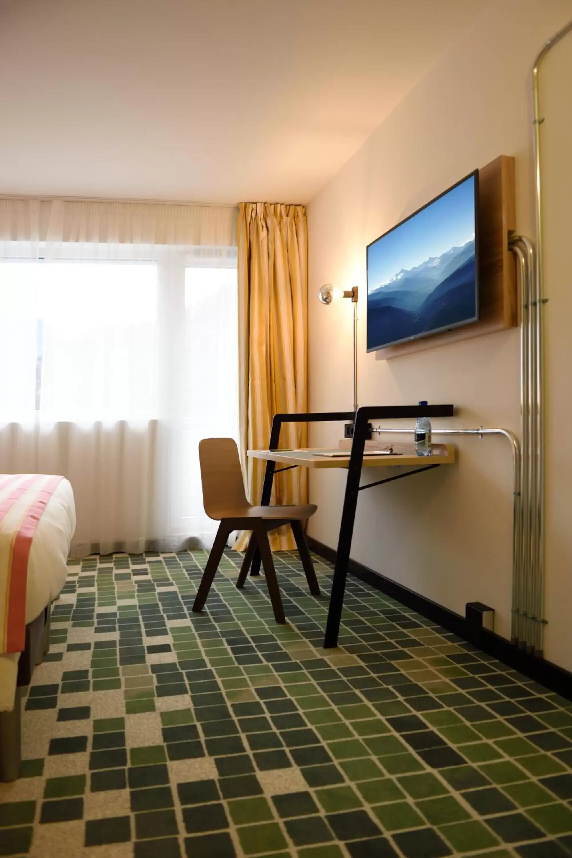 Bedroom, TV/Entertainment Center in ibis Styles Sierre