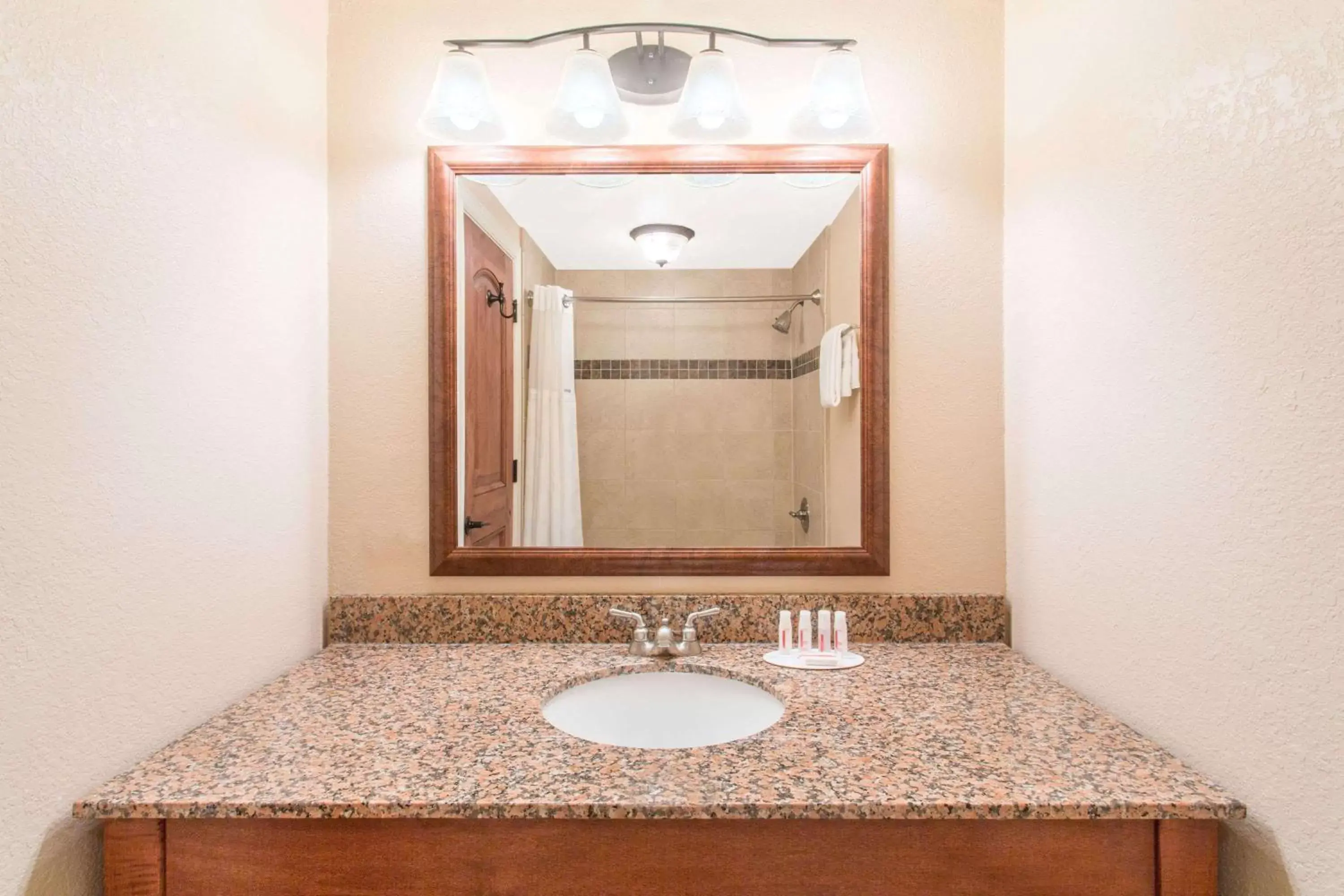 Bathroom in Ramada by Wyndham Elko Hotel at Stockmen's Casino