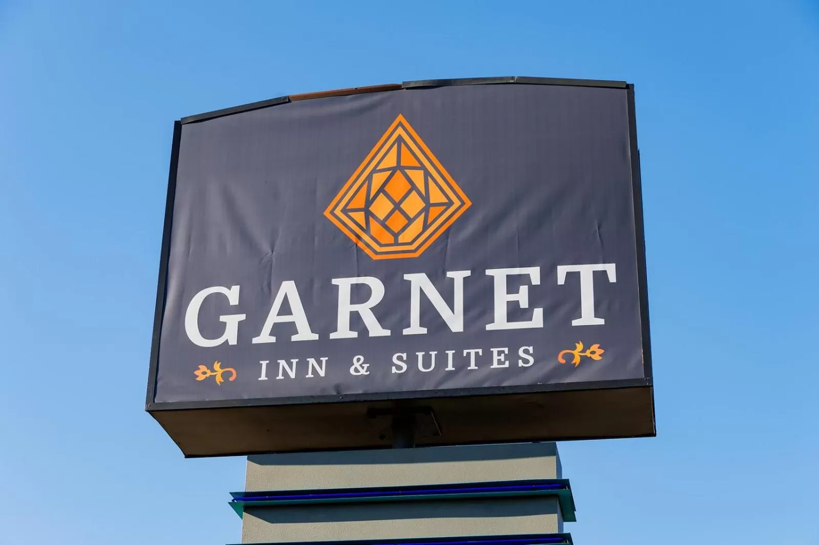 Property logo or sign in Garnet Inn & Suites, Orlando