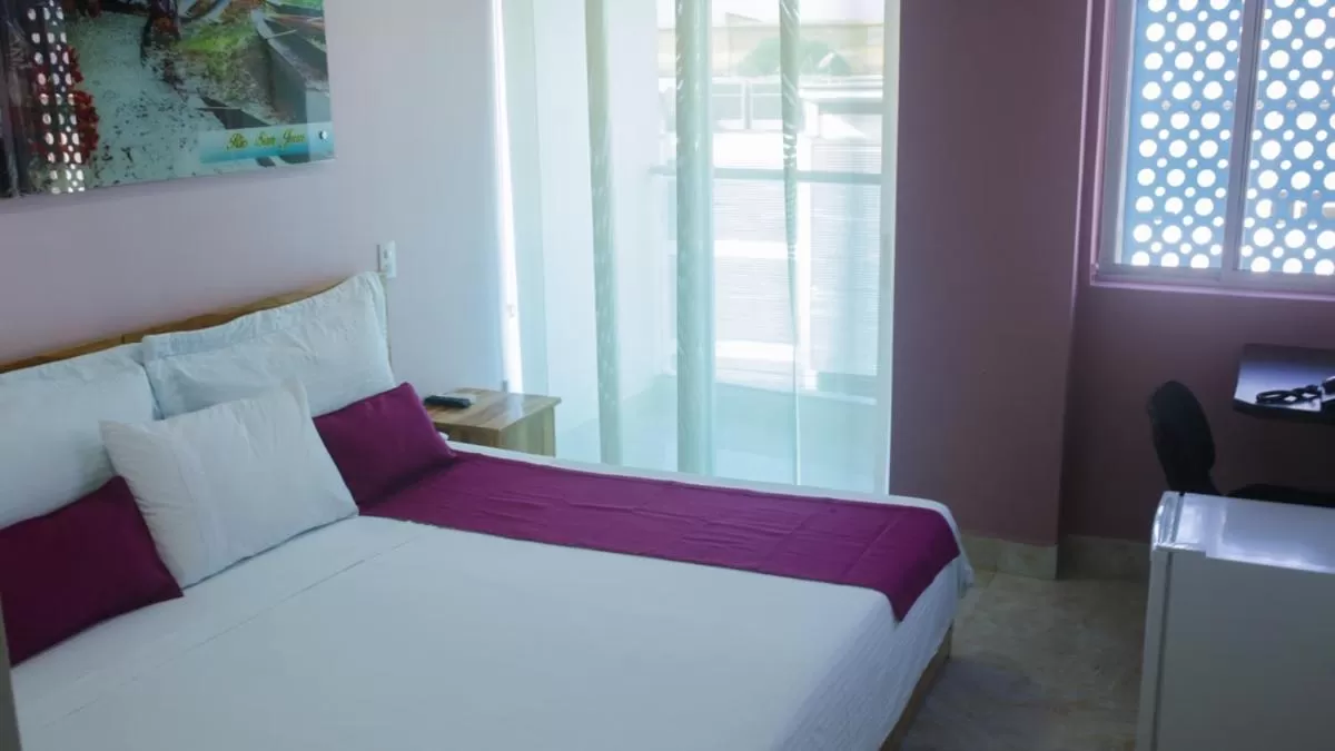 Bed in Kamaleb Farallones Hotel