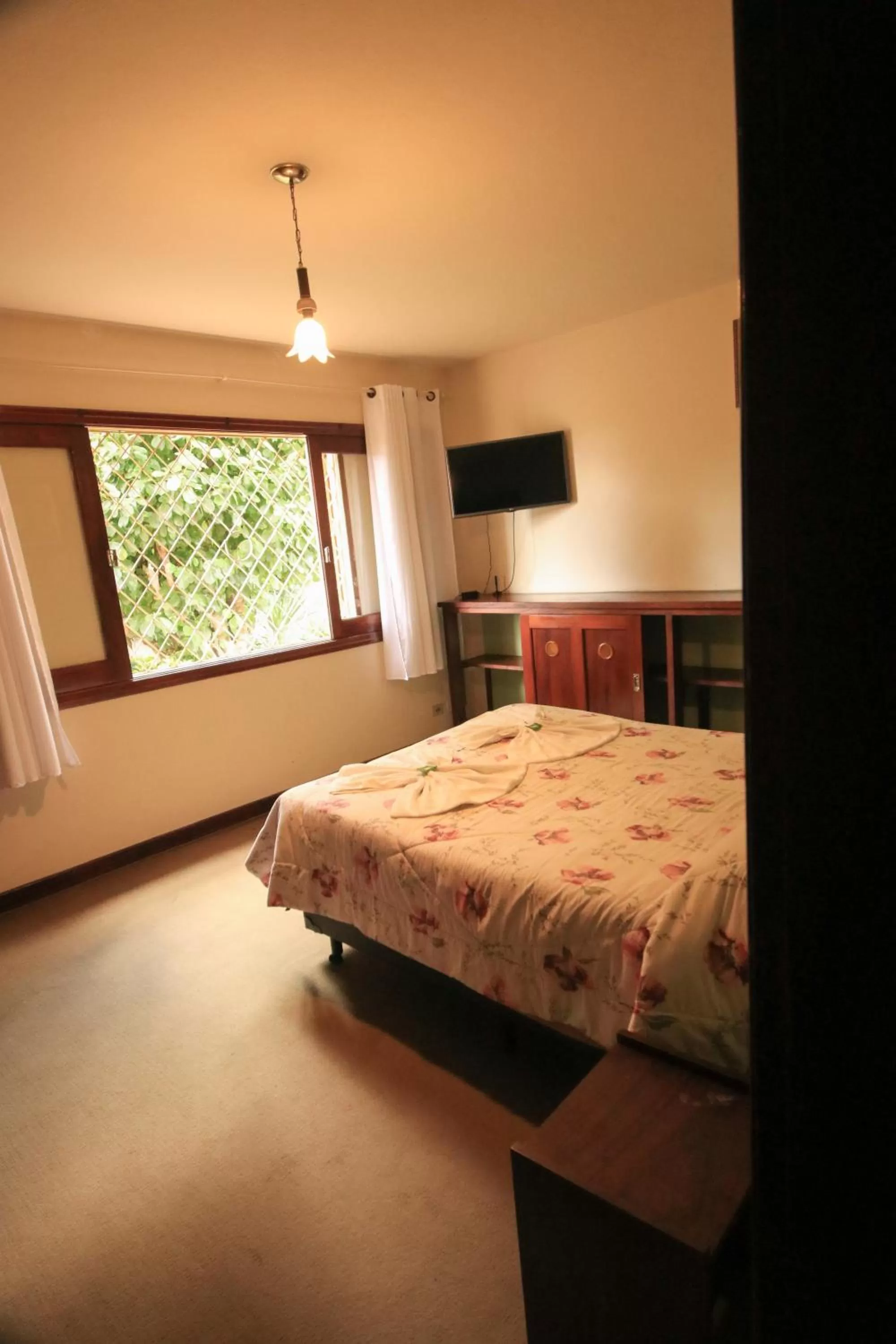 Bed in Pousada Curumi