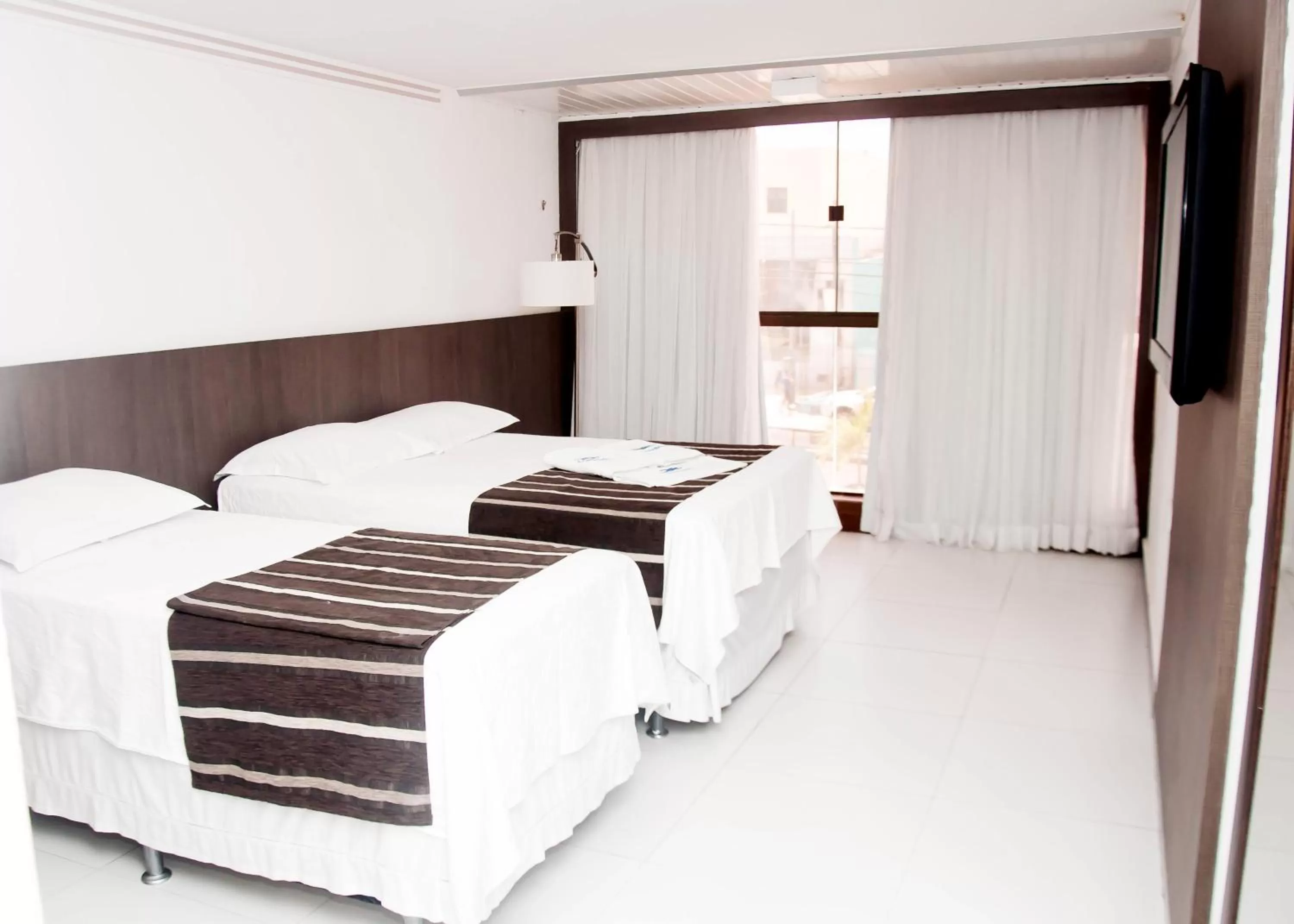 Bed, Room Photo in Tirol Praia Hotel