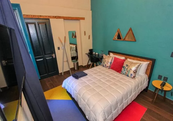 Bed in Antigua Trece Hotel Fusión