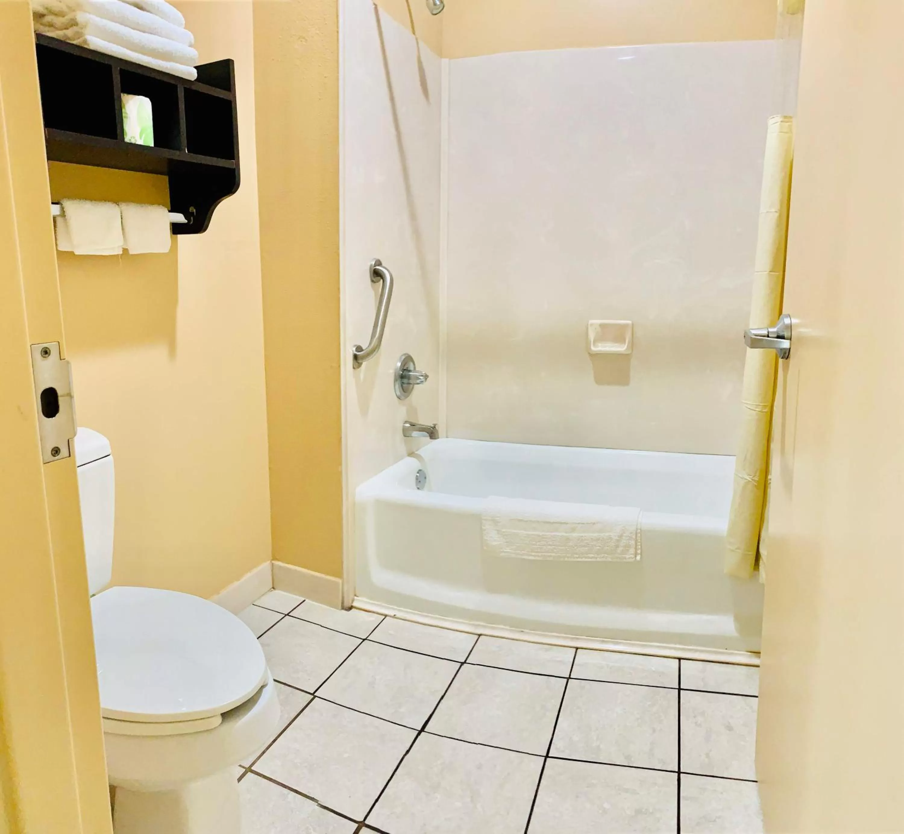 Toilet in Weston Inn & Suites