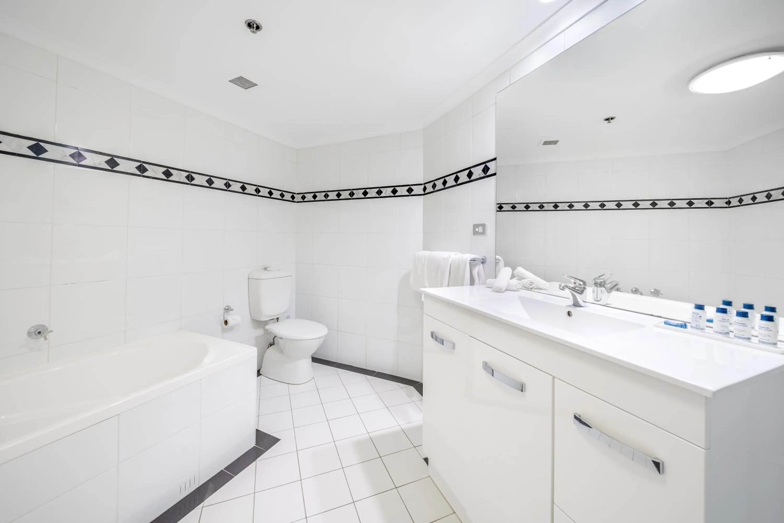 Toilet in Oaks Sydney Castlereagh Suites