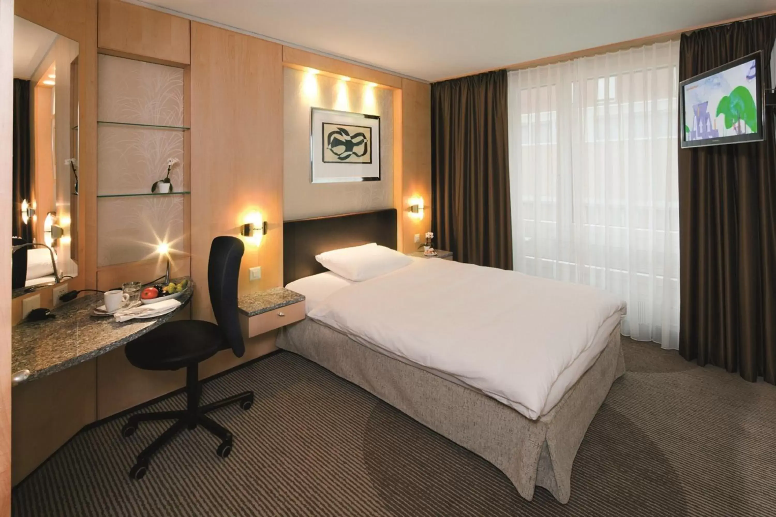 Photo of the whole room, Bed in Mövenpick Hotel Zürich-Regensdorf